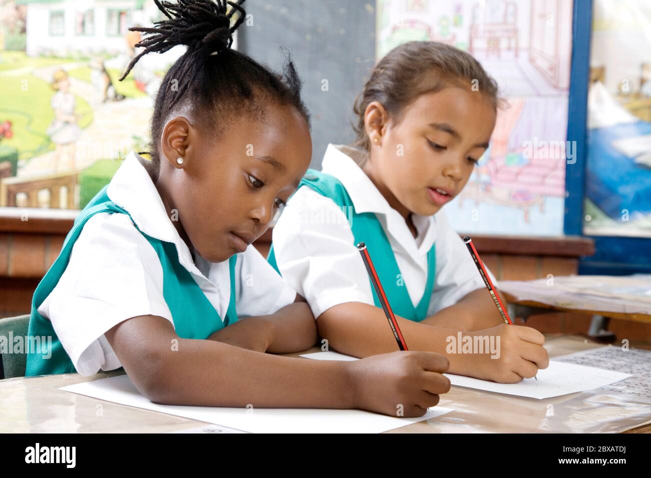 Writing Girl In Class Two drawing girls hi-res stock photography and images - Alamy