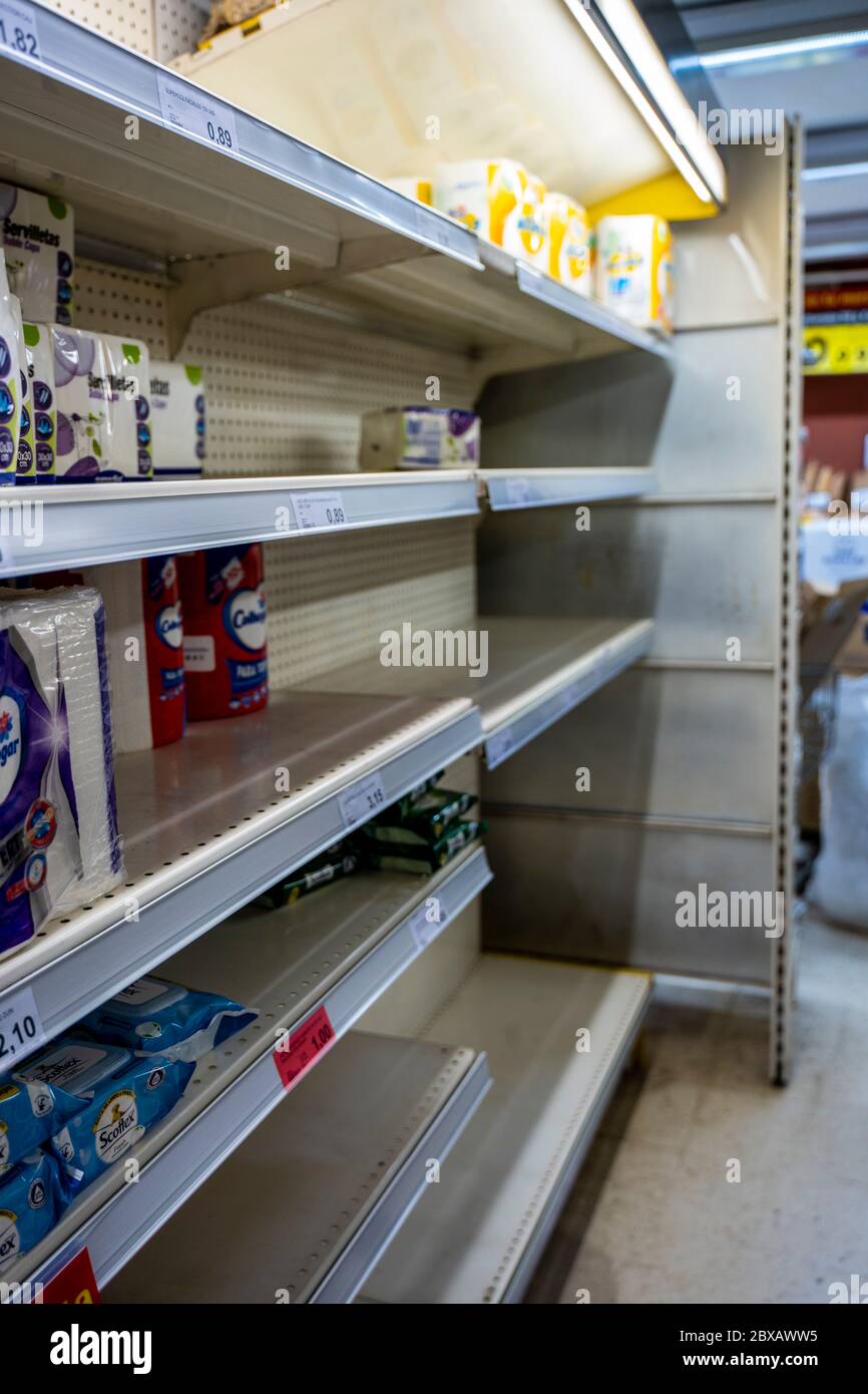 Coronavirus. Empty shelves without toilet paper due to panic buying caused by COVID-19 crisis. Shortage basic supplies at the supermarket. Malaga, Spa Stock Photo
