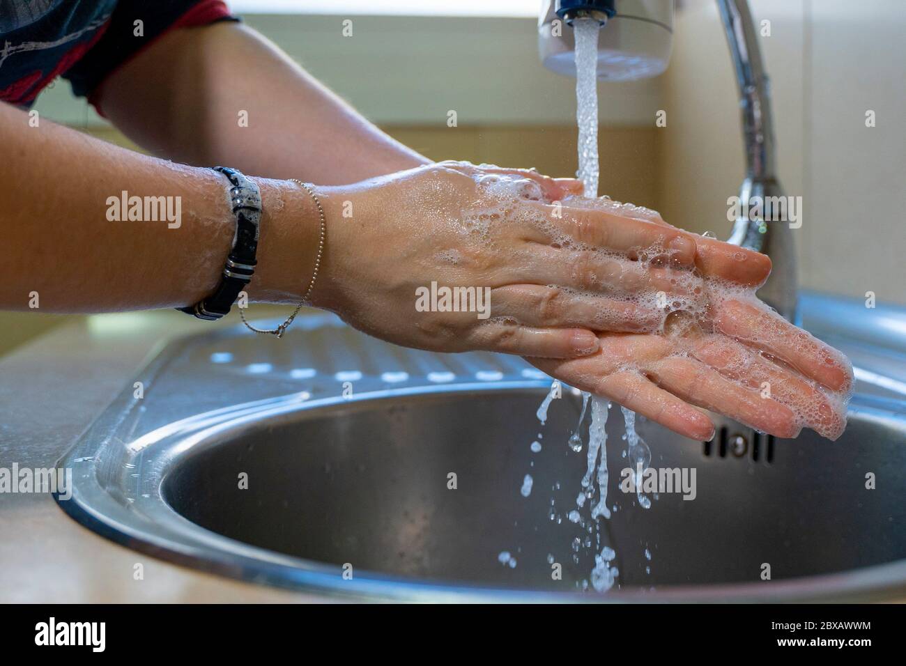 Washing hands properly. Hygiene concept. Rubbing with soap and water ...