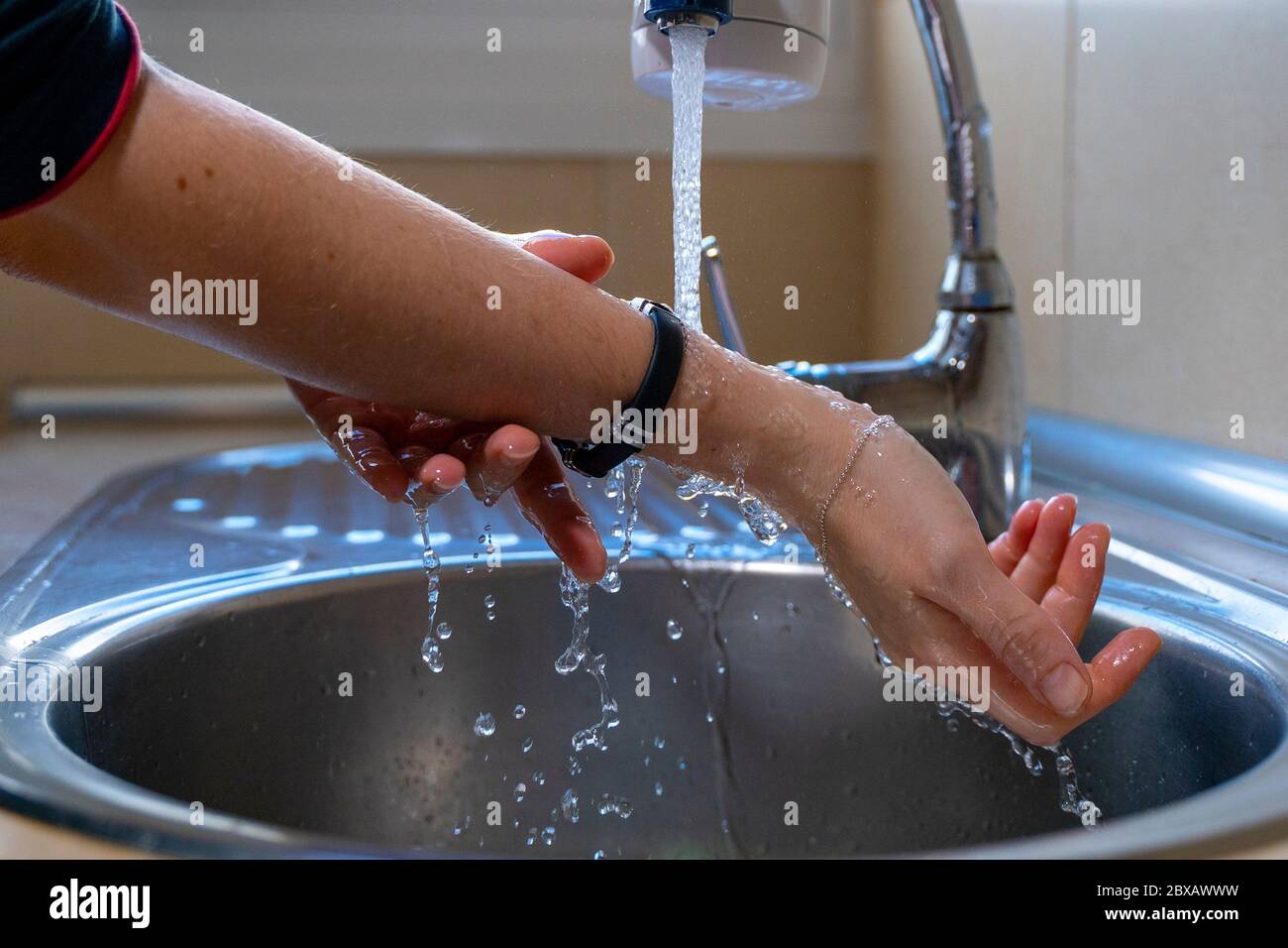 Washing arms and hands properly. Hygiene concept. Rubbing with water