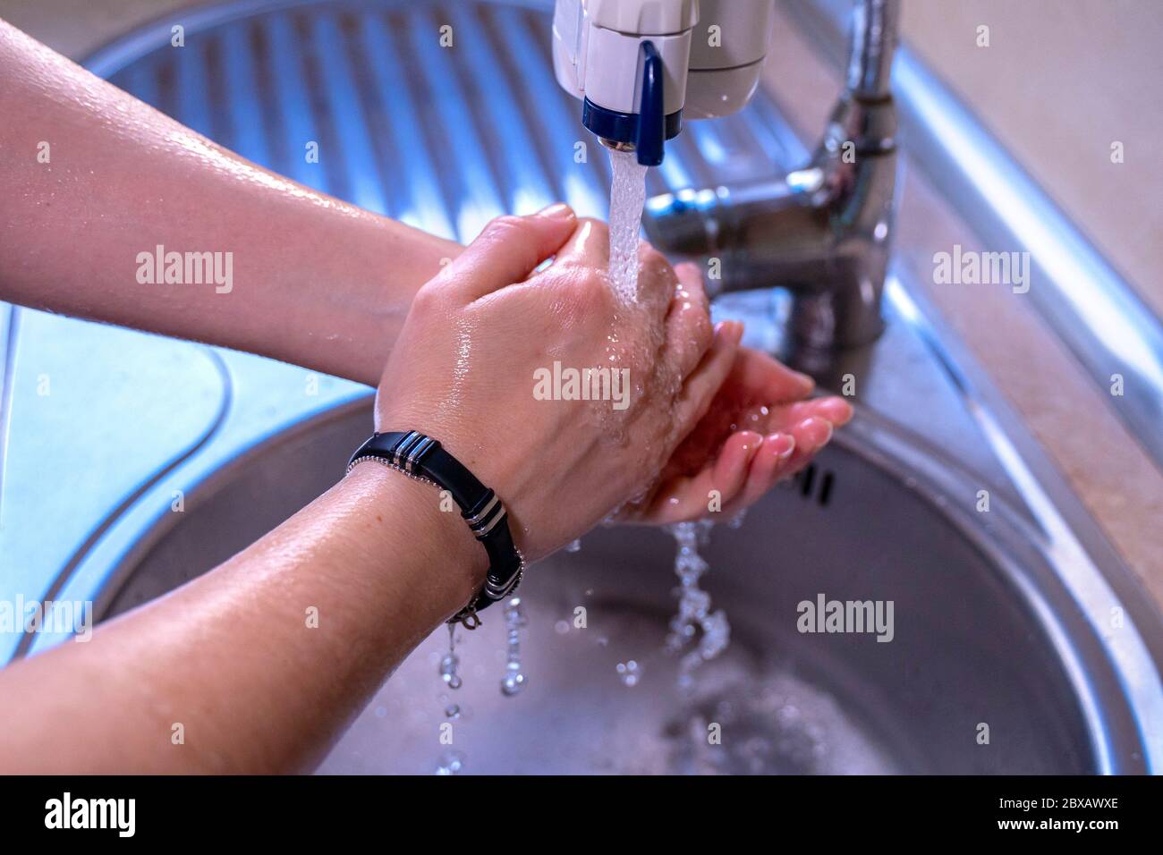 Washing hands properly. Splashing water. Hygiene concept. High angle