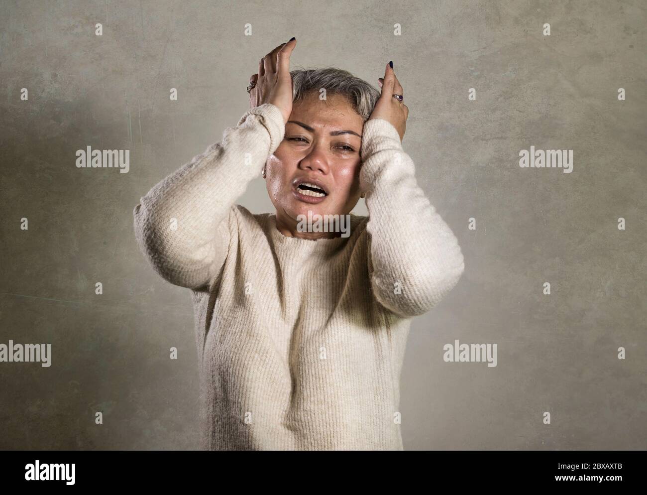 Indonesian woman crying hi-res stock photography and images - Alamy
