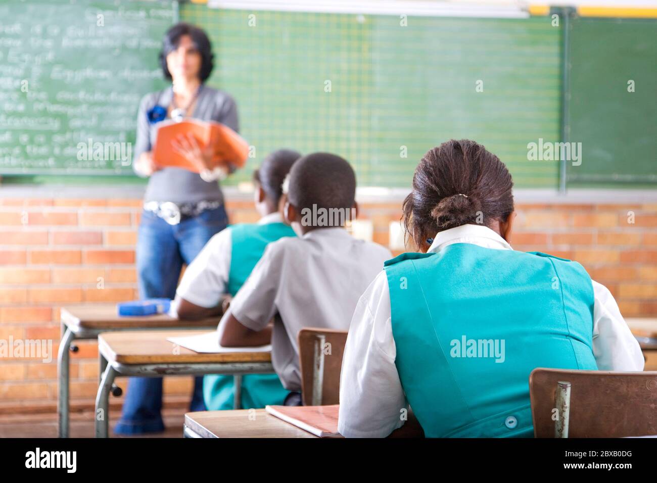Teacher and students in class Stock Photo - Alamy
