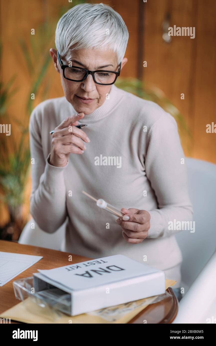 Tube and swab for DNA collection from mouth Stock Photo