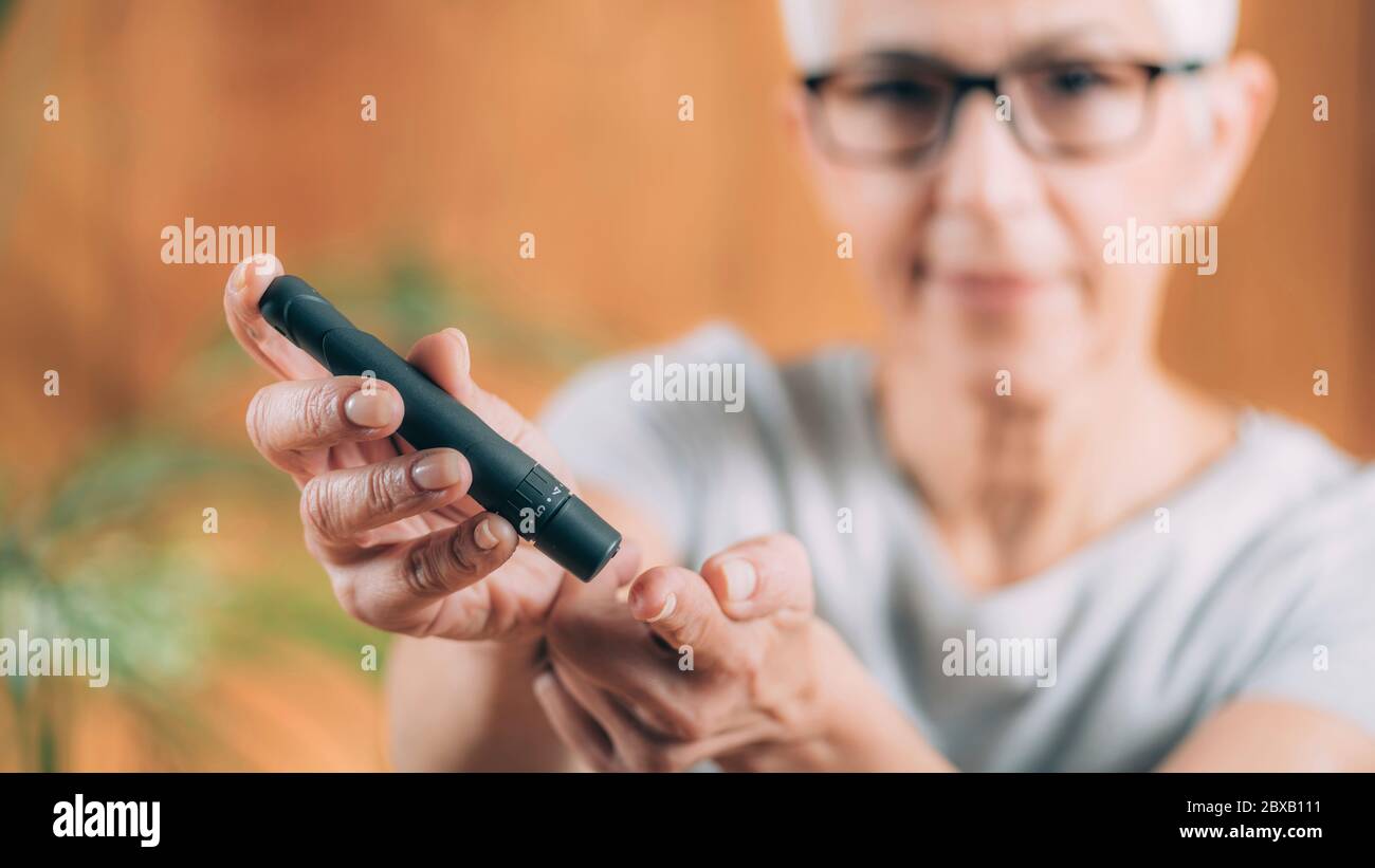Diabetes blood sugar test at home Stock Photo Alamy