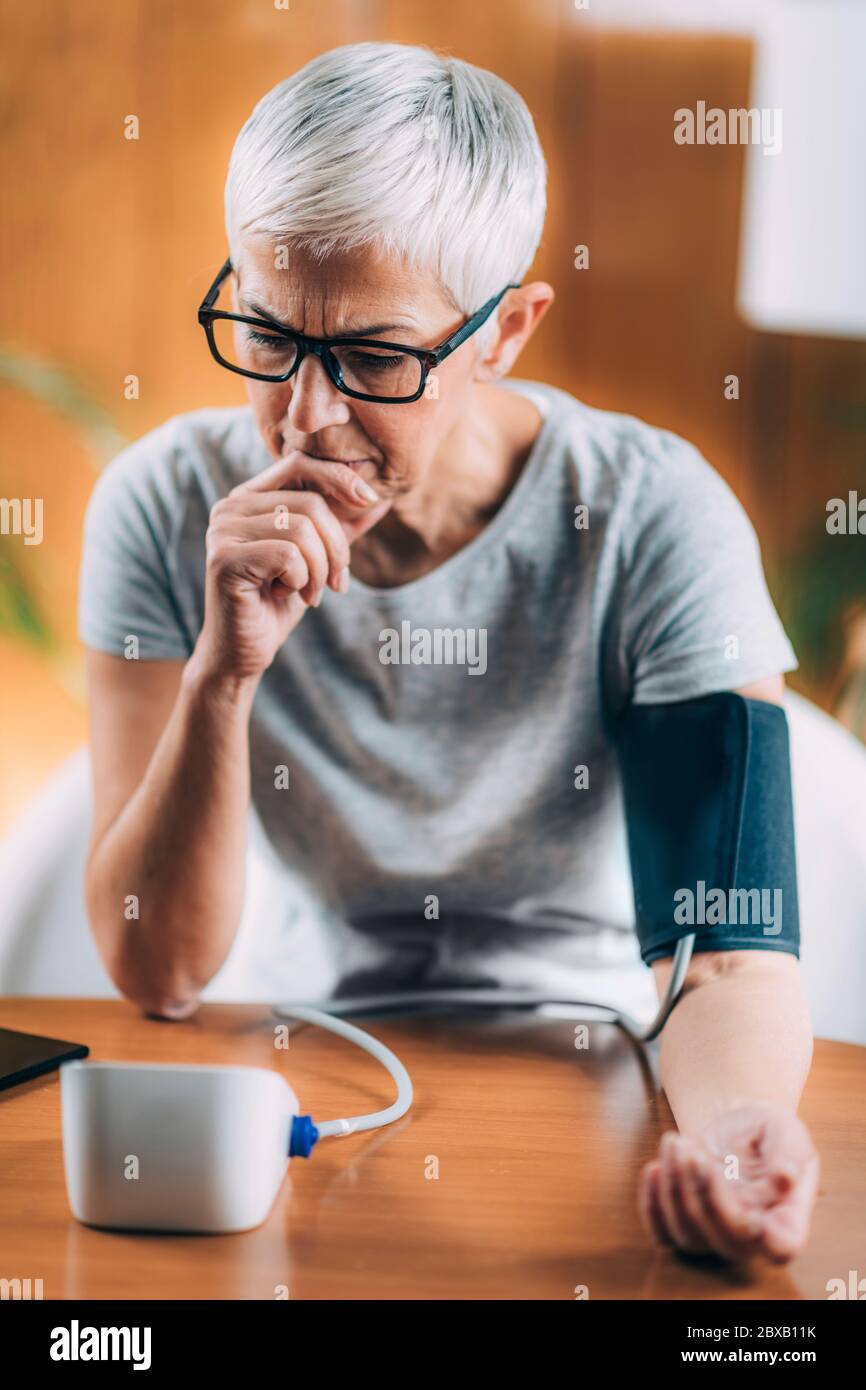 Blood pressure test at home Stock Photo Alamy