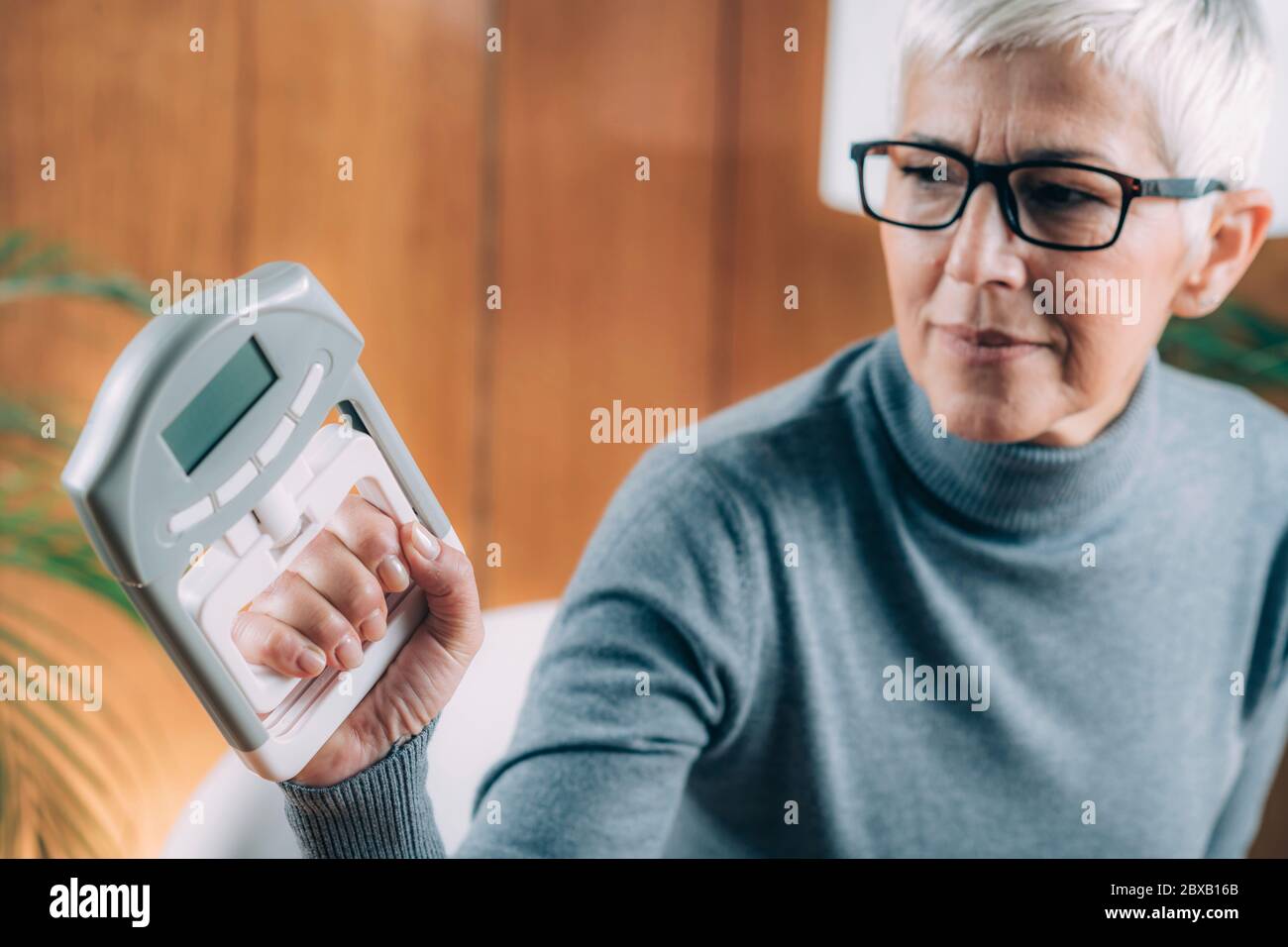 Hand dynamometer grip strength test Stock Photo