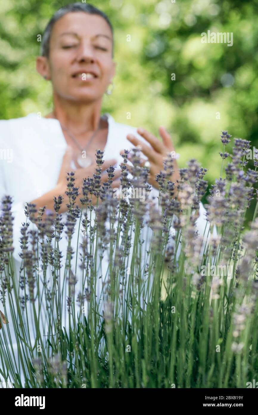 Breathing exercise in a lavender field Stock Photo