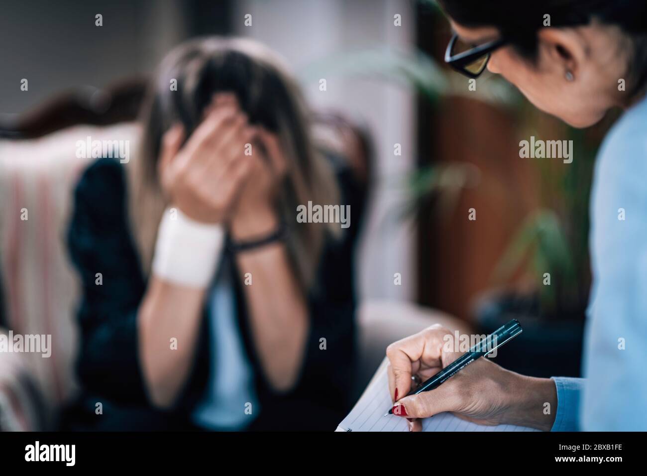 Psychotherapist in session with mental health patient Stock Photo