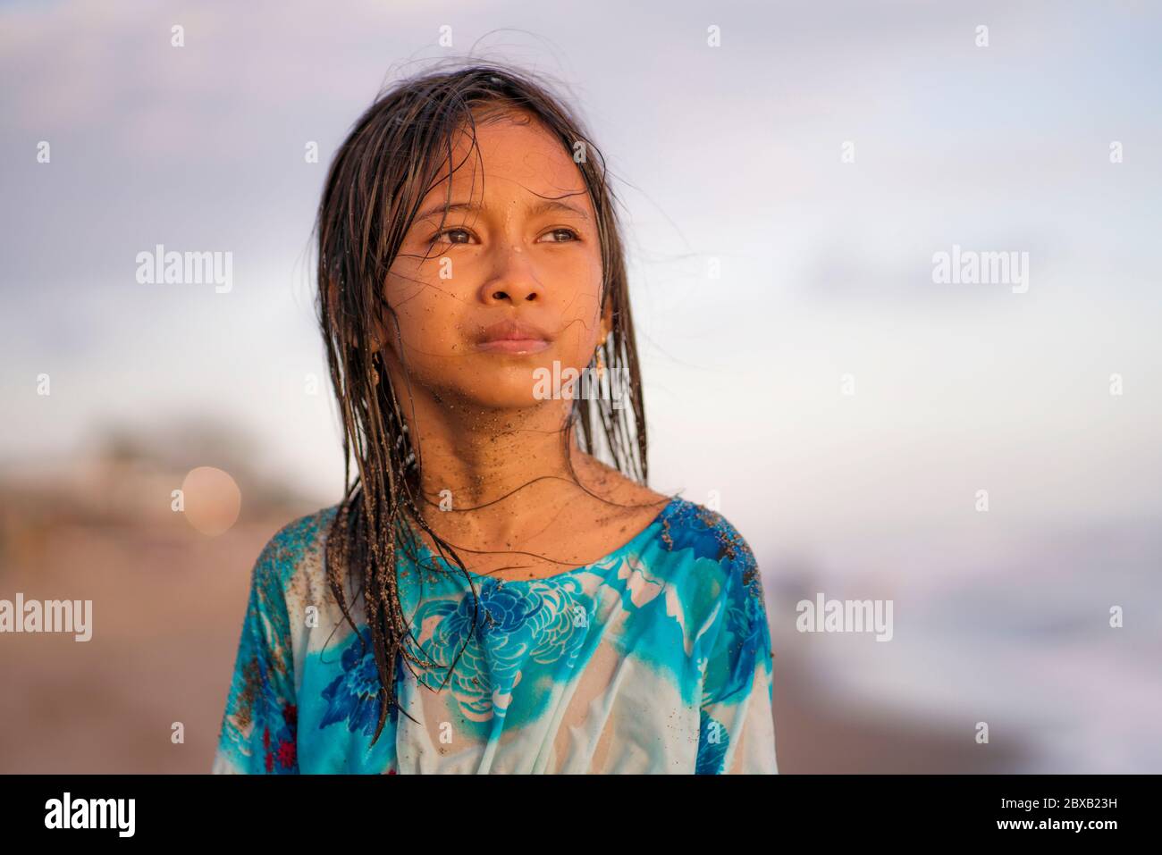 beach lifestyle portrait of young beautiful and happy 7 or 8 years old  Asian American mixed child girl with wet hair enjoying holidays playing in  the Stock Photo - Alamy