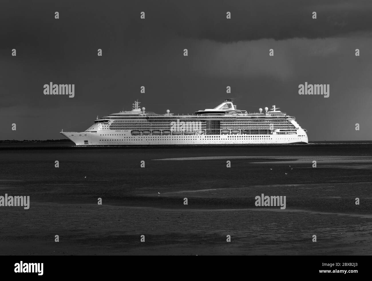 GTS Jewel of the Seas a Radiance class cruise ship heading for the Port of Southampton during the Coronavirus  pandemic , The Solent,  England, UK Stock Photo