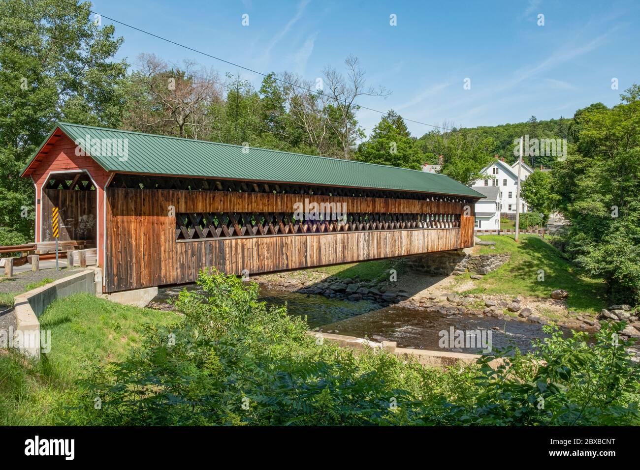 Ware–Hardwick Covered Bridge is a historic covered bridge spanning the Ware River on Old Gilbertville Road and Bridge Street in Ware and Hardwick, MA Stock Photo