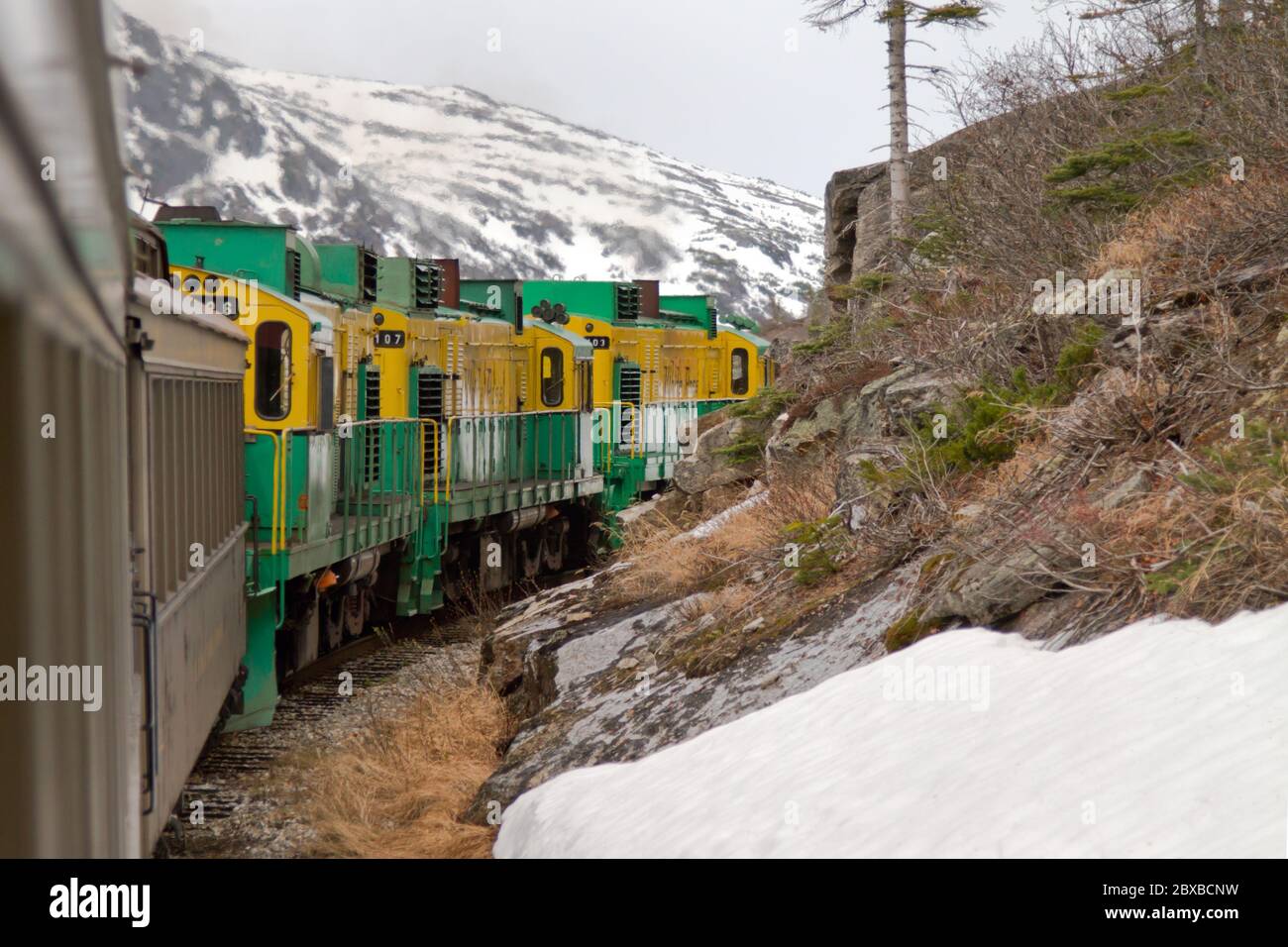 A view of the Summit Excursion, Yukon and White Pass Railway tour from Skagway to the White Pass Summit.  Built in 1898 during the Klondike Gold Rush. Stock Photo