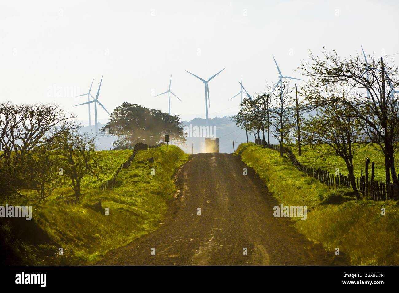 vehicles, wind turbines, Guanacaste Province, northern Costa Rica, Central America, Costa Rica provides most of its electricity needs via alternative Stock Photo