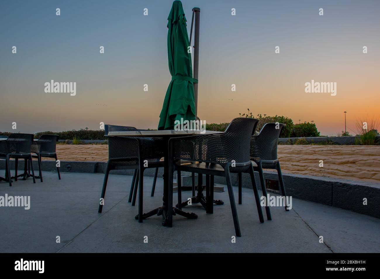 Early morning view of table and chairs of luxury restaurant near seaside at kuwait city Stock Photo