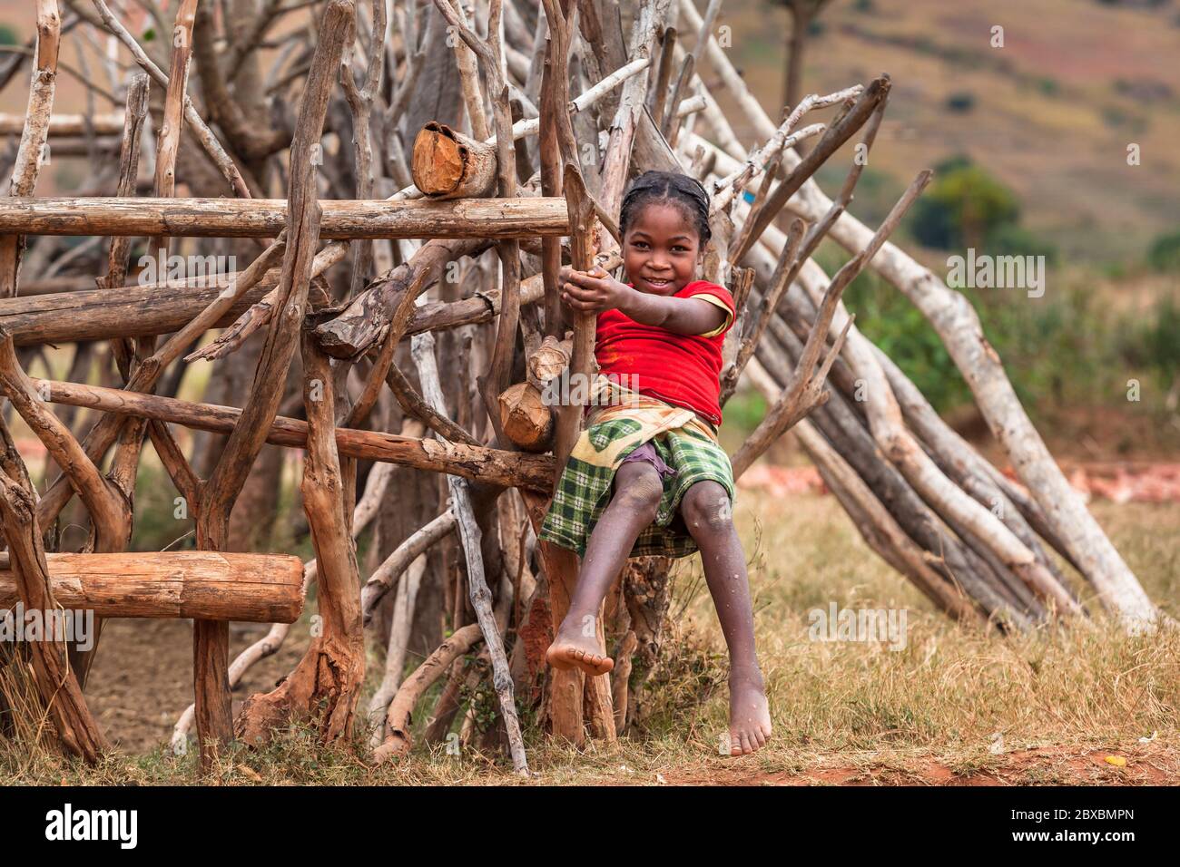 Shy pretty african girl portrait in rural landscape Stock Photo