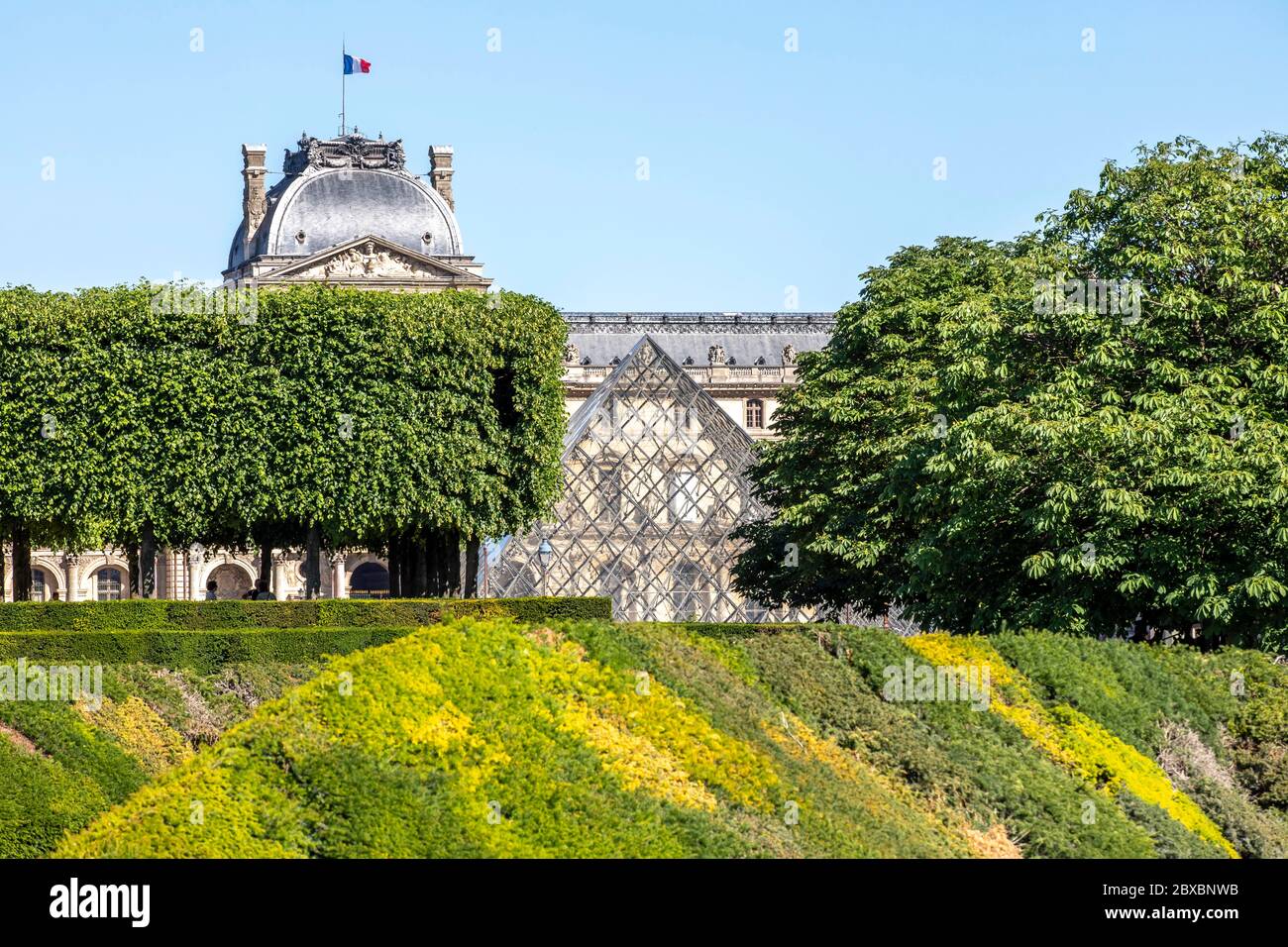 Paris, France - May 29, 2020: Louvre museum as seen from Jardin des Tuileries in Paris Stock Photo