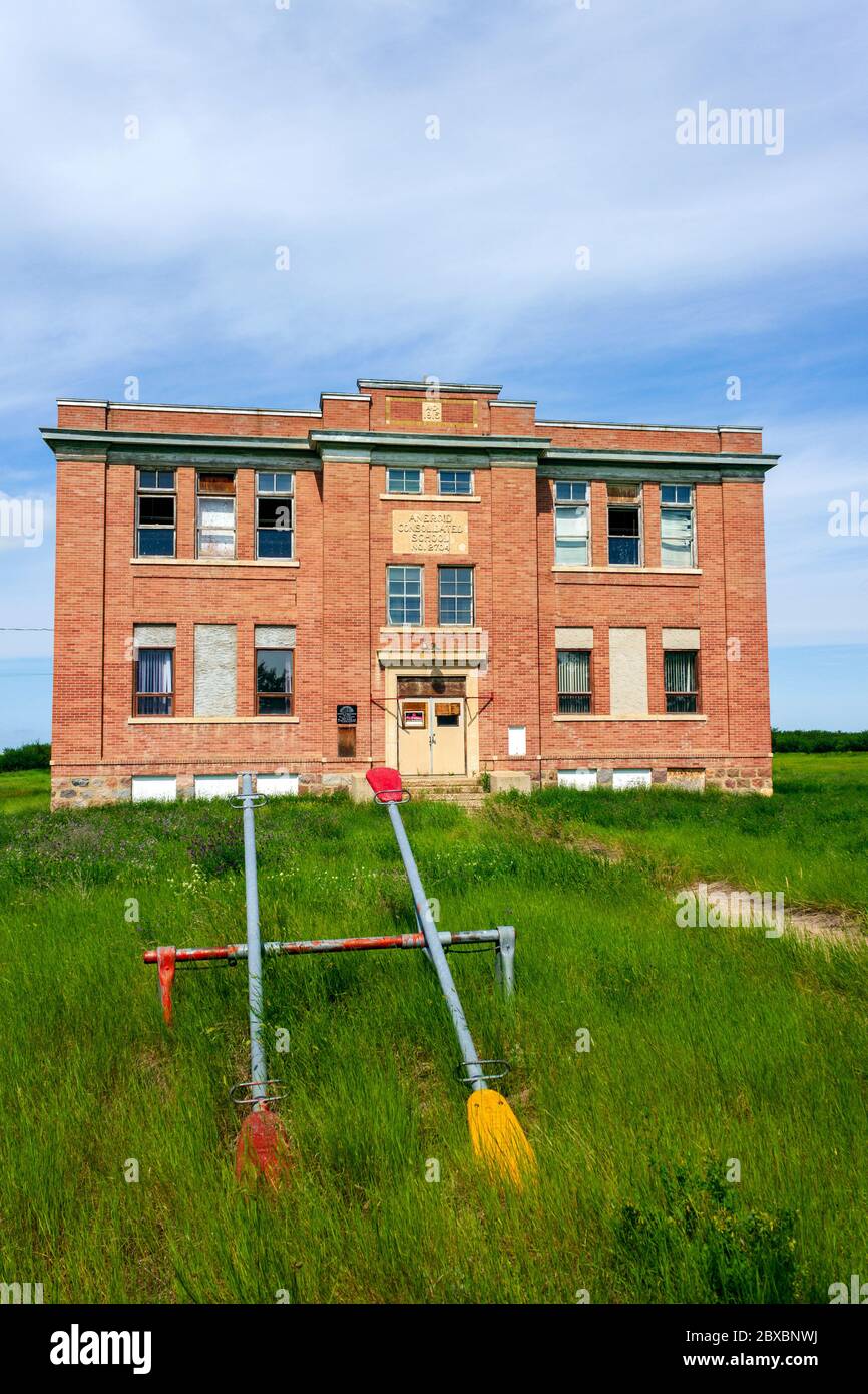 Aneroid, Saskatchewan, Canada - August 7, 2019: Old abandoned Public School in the small community of Aneroid, Saskatchewan, Canada. The two-storey, b Stock Photo