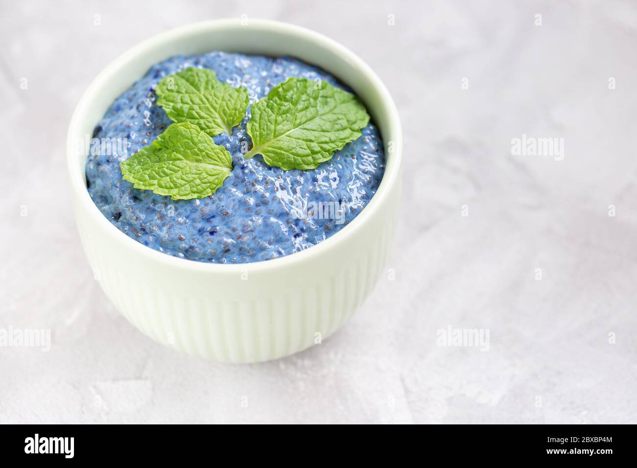 Blue spirulina chia seed pudding in bowl Stock Photo Alamy