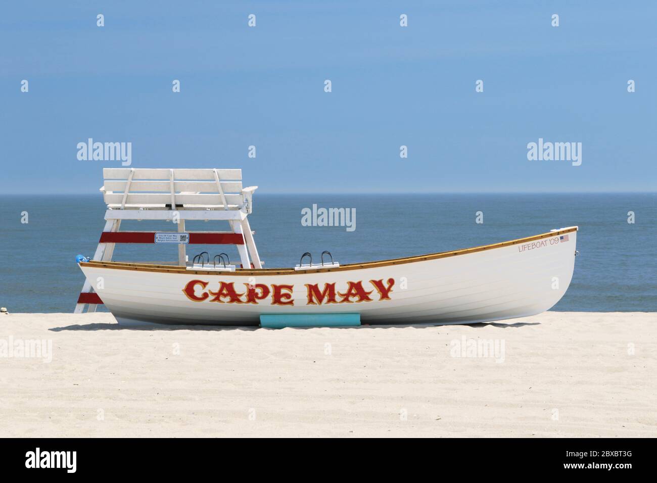 A lifeboat with lifeguard chairs on the beach in Cape May, New Jersey