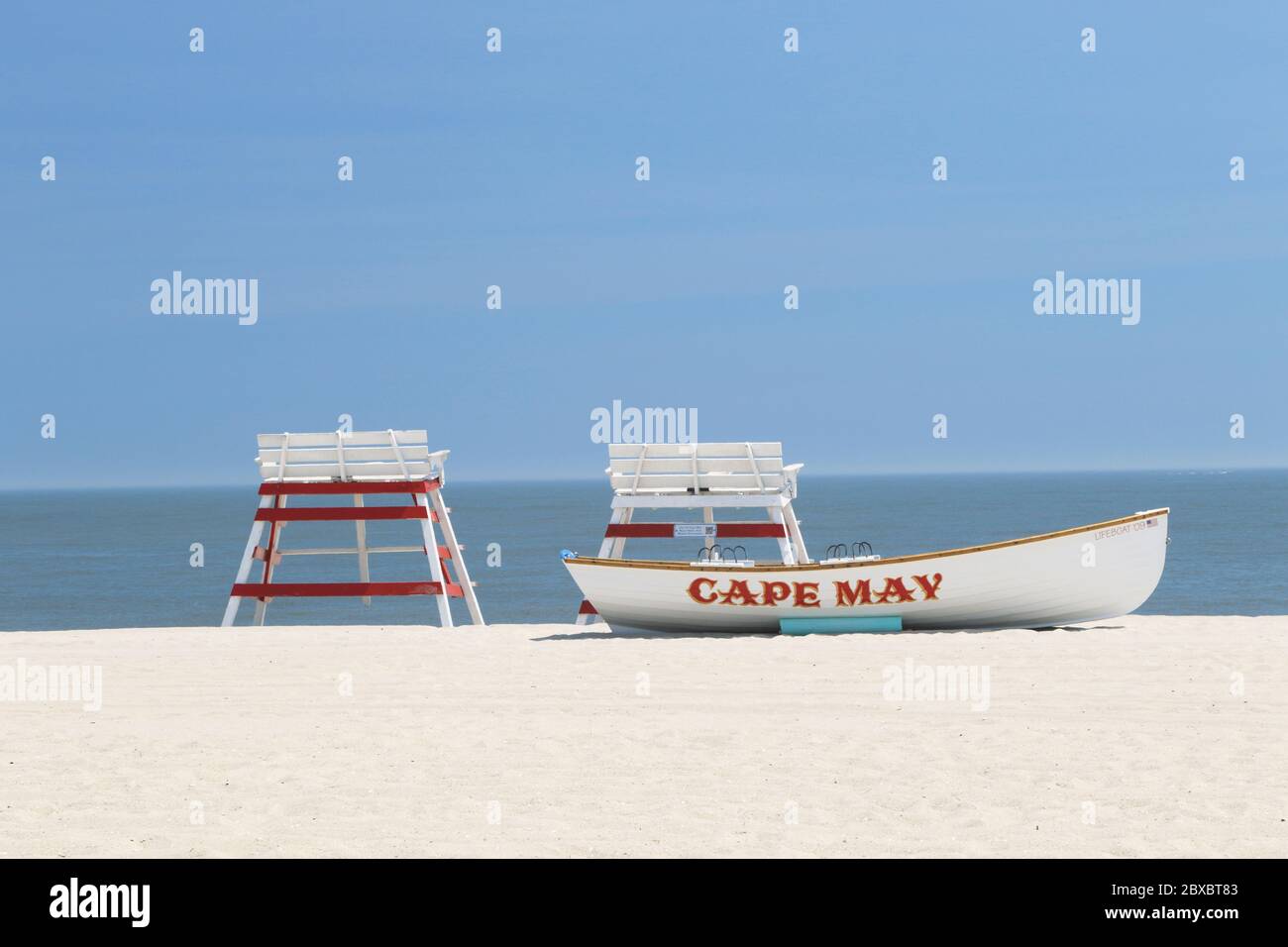 A lifeboat with lifeguard chairs on the beach in Cape May, New Jersey