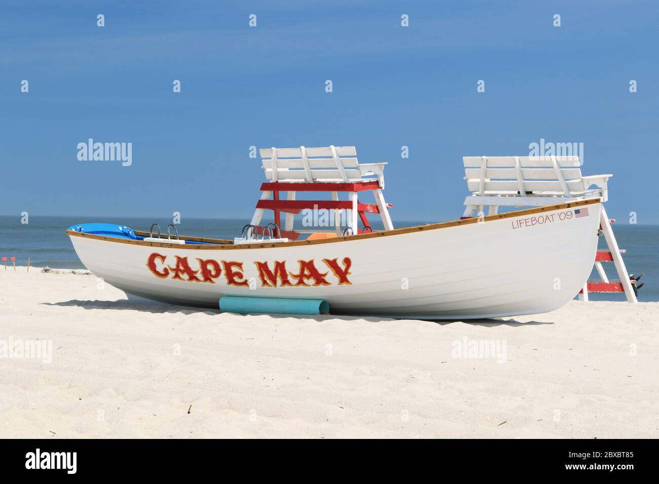 A lifeboat with lifeguard chairs on the beach in Cape May, New Jersey