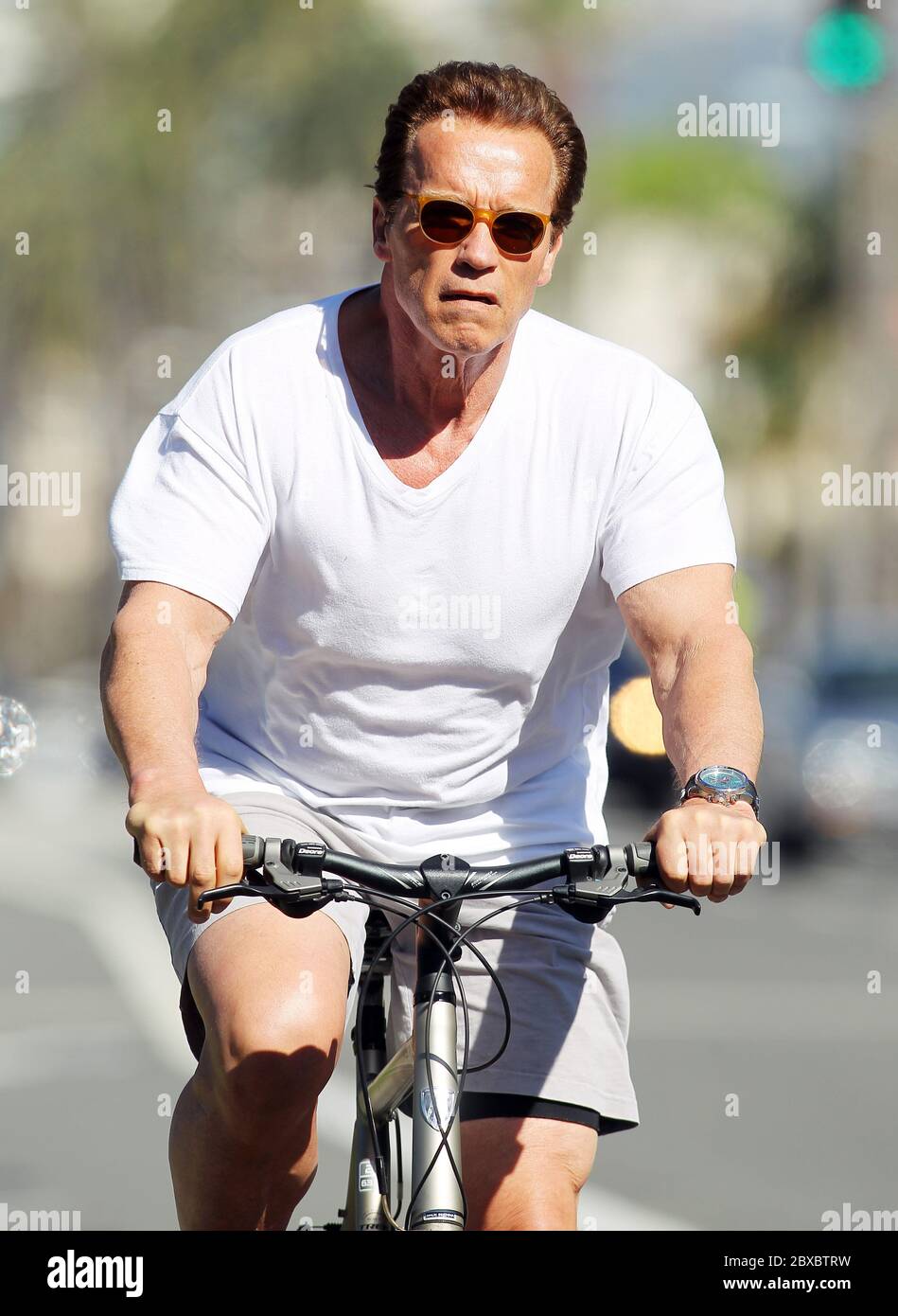 Arnold Schwarzenegger spent the morning cycling with his bodyguards, Santa Monica, California 2011 Stock Photo