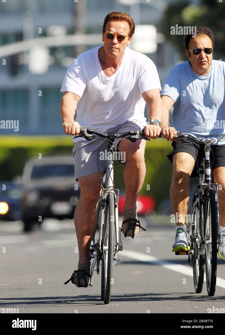 Arnold Schwarzenegger spent the morning cycling with his bodyguards, Santa Monica, California 2011 Stock Photo