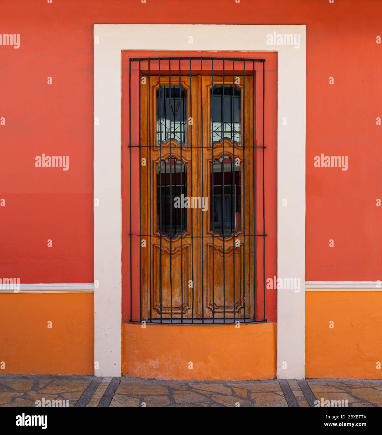 Colorful colonial style facade with window, San Cristobal de las Casas, Chiapas, Mexico. Stock Photo