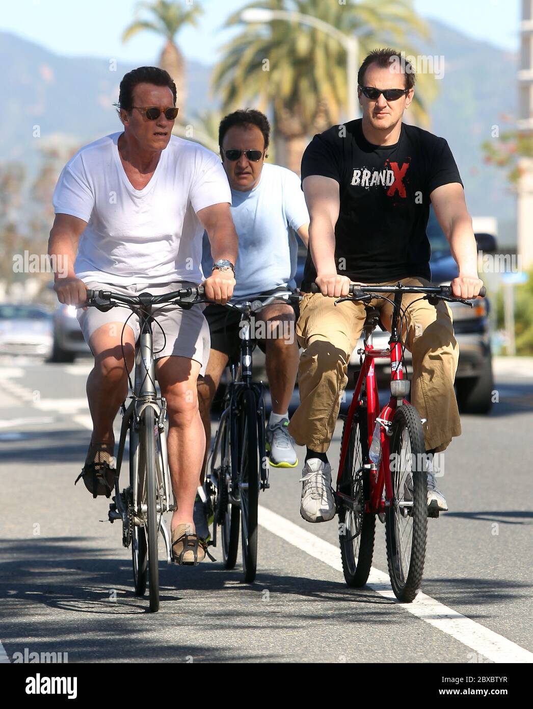 Arnold Schwarzenegger spent the morning cycling with his bodyguards, Santa Monica, California 2011 Stock Photo