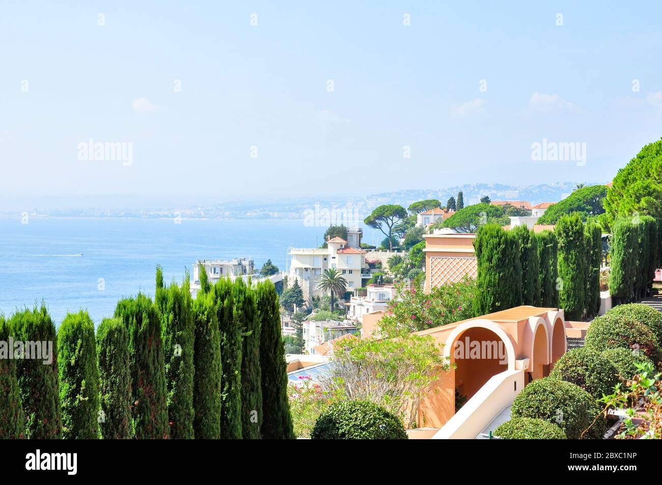 A view from Boulevard Maurice Maeterlinck of the buildings below on Le Cap de Nice and Nice in the distance, France Stock Photo