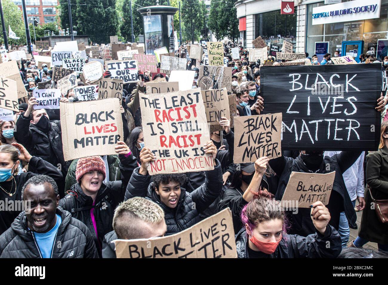 Manchester, UK. 06th June, 2020. Black lives matter Protest in Manchester UK.Thousands of people - most of whom were wearing facemasks - gathered in Piccadilly Gardens today (June 6). The protest began with protestors kneeling in a two minute silence to honour George Floyd. Council Leader Richard Leese thanked protesters for their “exemplary behaviour” but urged caution in the wake of Covid-19 and said social distancing remains vital. Today's protest was one of three due to take place in Manchester over the weekend as part of the Black Lives Matter Movement. Credit: Gary Roberts/Alamy Live New Stock Photo