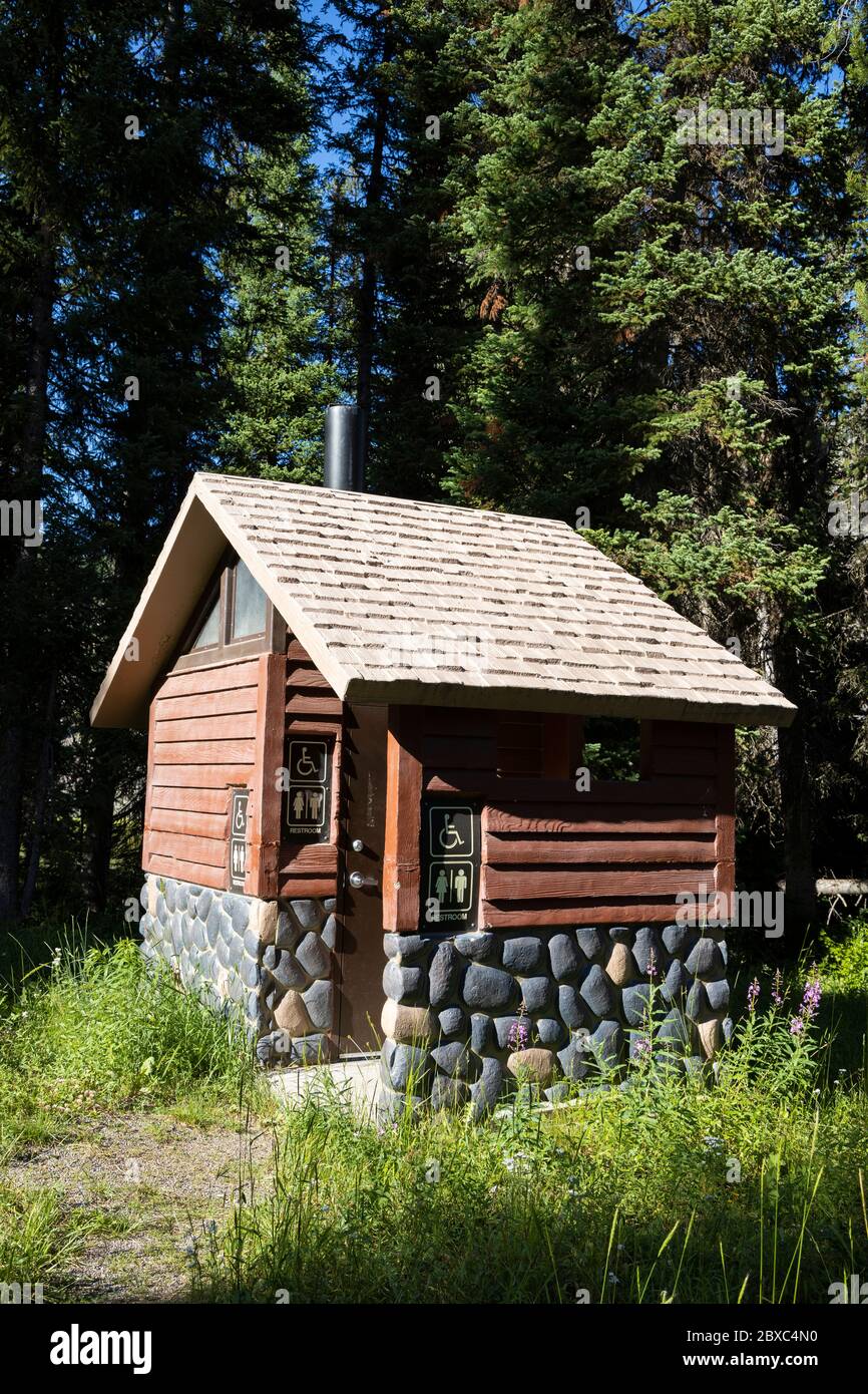 Restroom facility at a campsite near Grassy Lake Road in Grand Teton National Park, along the Great Divide Mountain Bike Route. Stock Photo