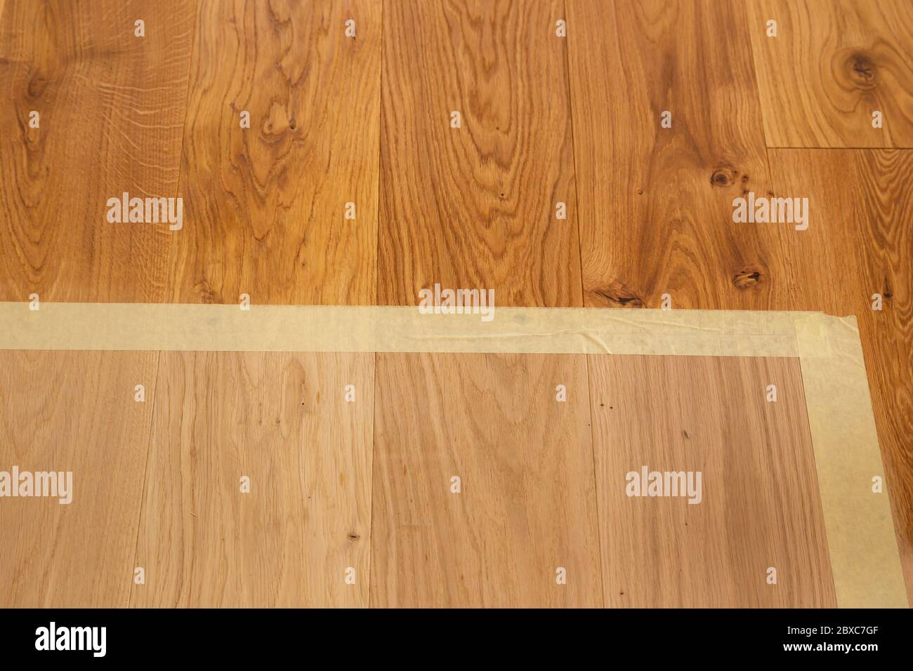 Comparison of luxury oak parquet flooring before and after application of oilbased floor finish