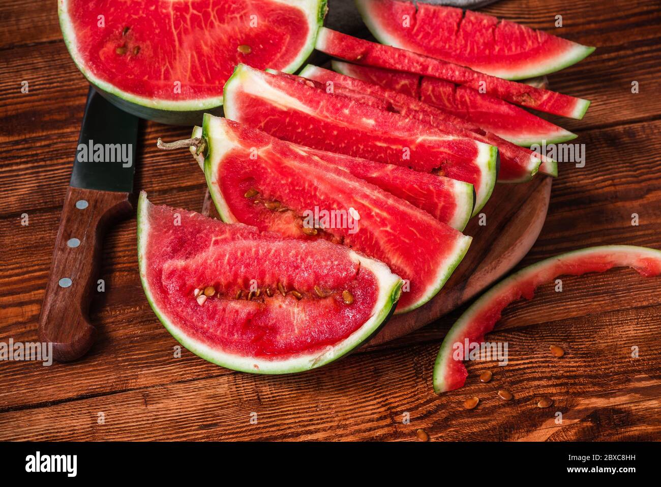Watermelon slices lying on the cutting board Stock Photo