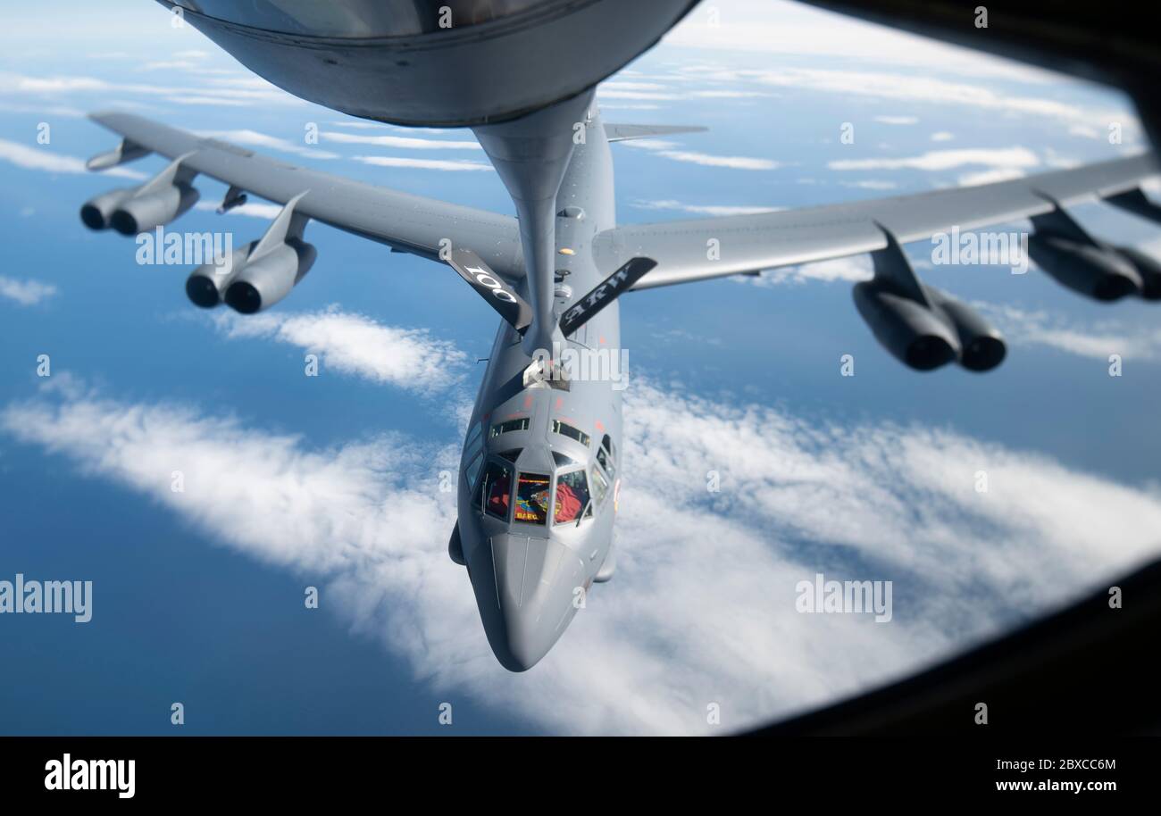A U.S. Air Force B-52 Stratofortress bomber aircraft from the 5th Bomb Wing, is refueled inflight from a KC-135 Stratotanker aircraft during a strategic bomber mission June 3, 2020 off the northern Norwegian coast. Stock Photo