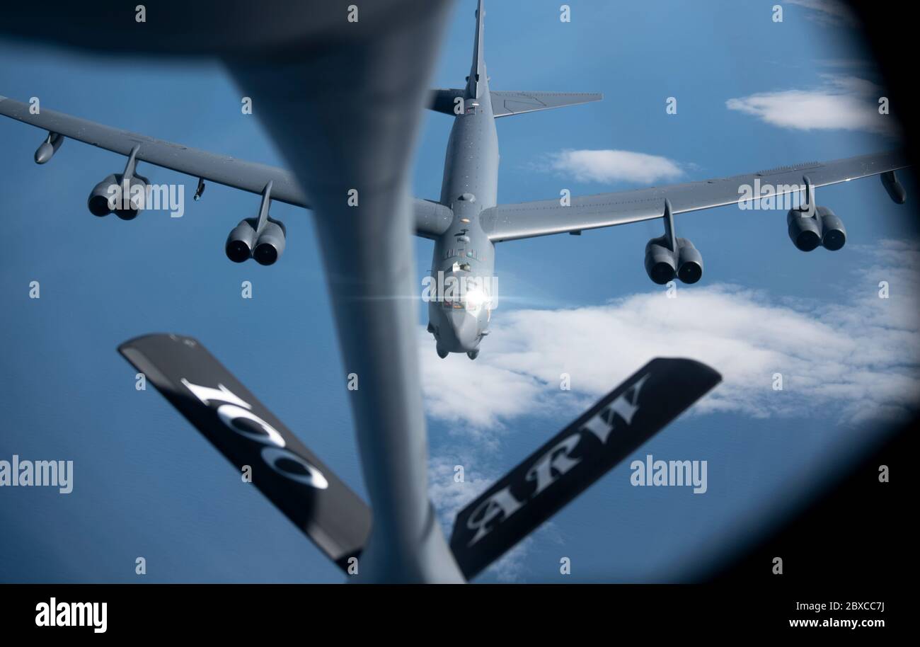 A U.S. Air Force B-52 Stratofortress bomber aircraft from the 5th Bomb Wing, approaches a KC-135 Stratotanker aircraft to refuel during a strategic bomber mission June 3, 2020 off the northern Norwegian coast. Stock Photo