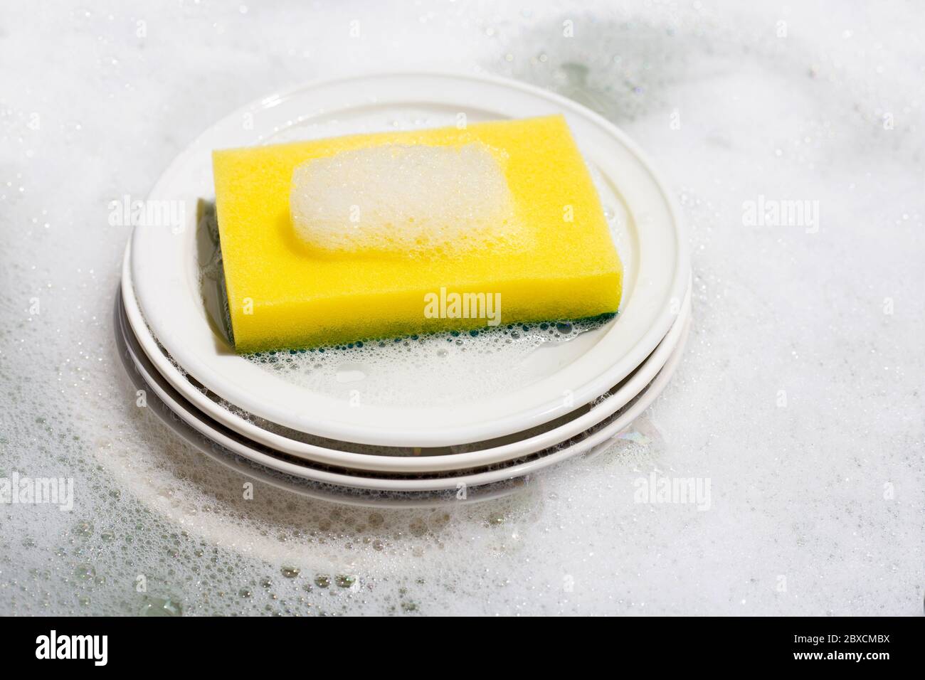Dish washing, Dirty dishes soaking in kitchen sink Stock Photo Alamy
