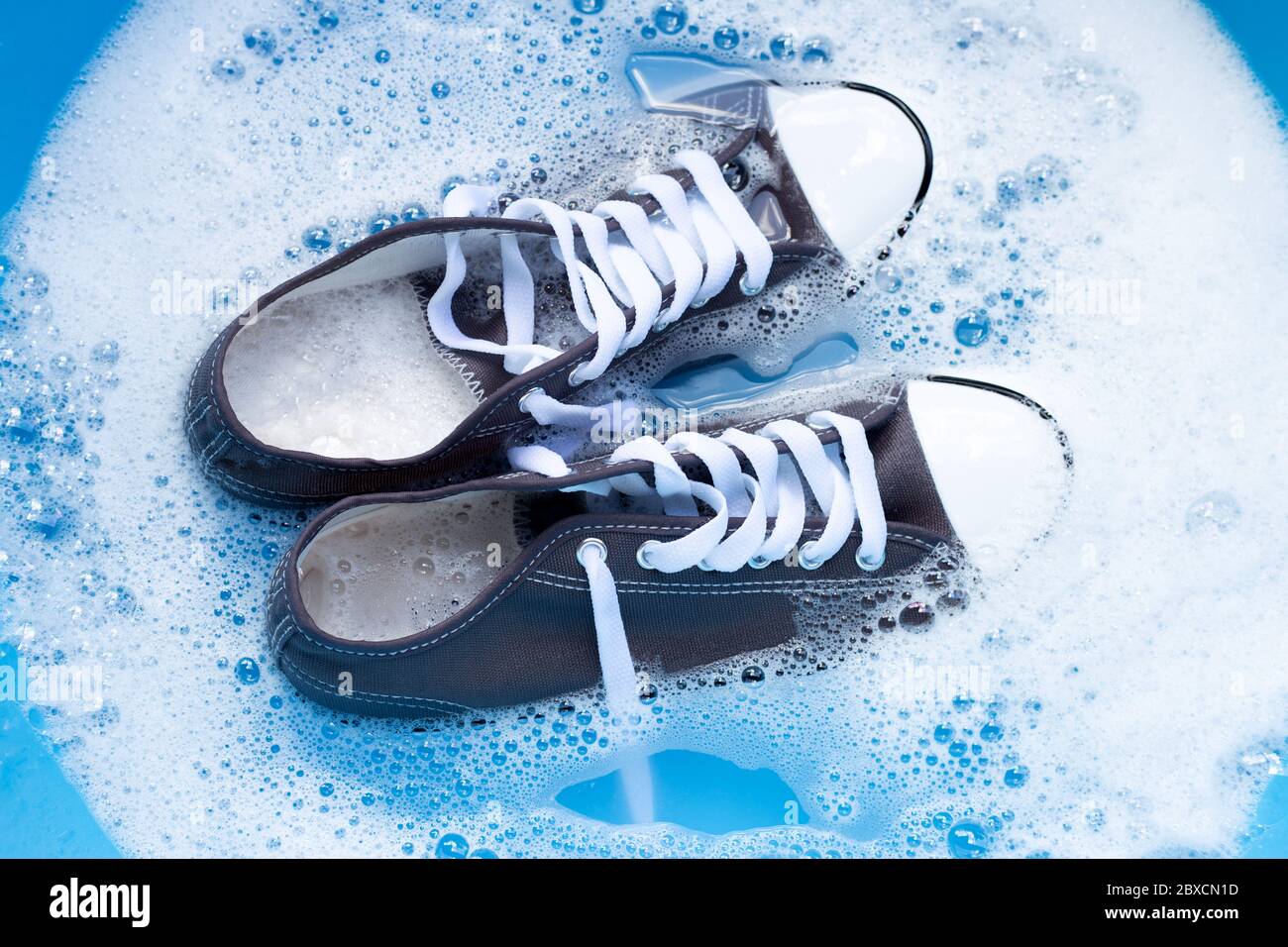 Soak shoes before washing. Cleaning Dirty sneakers Stock Photo Alamy