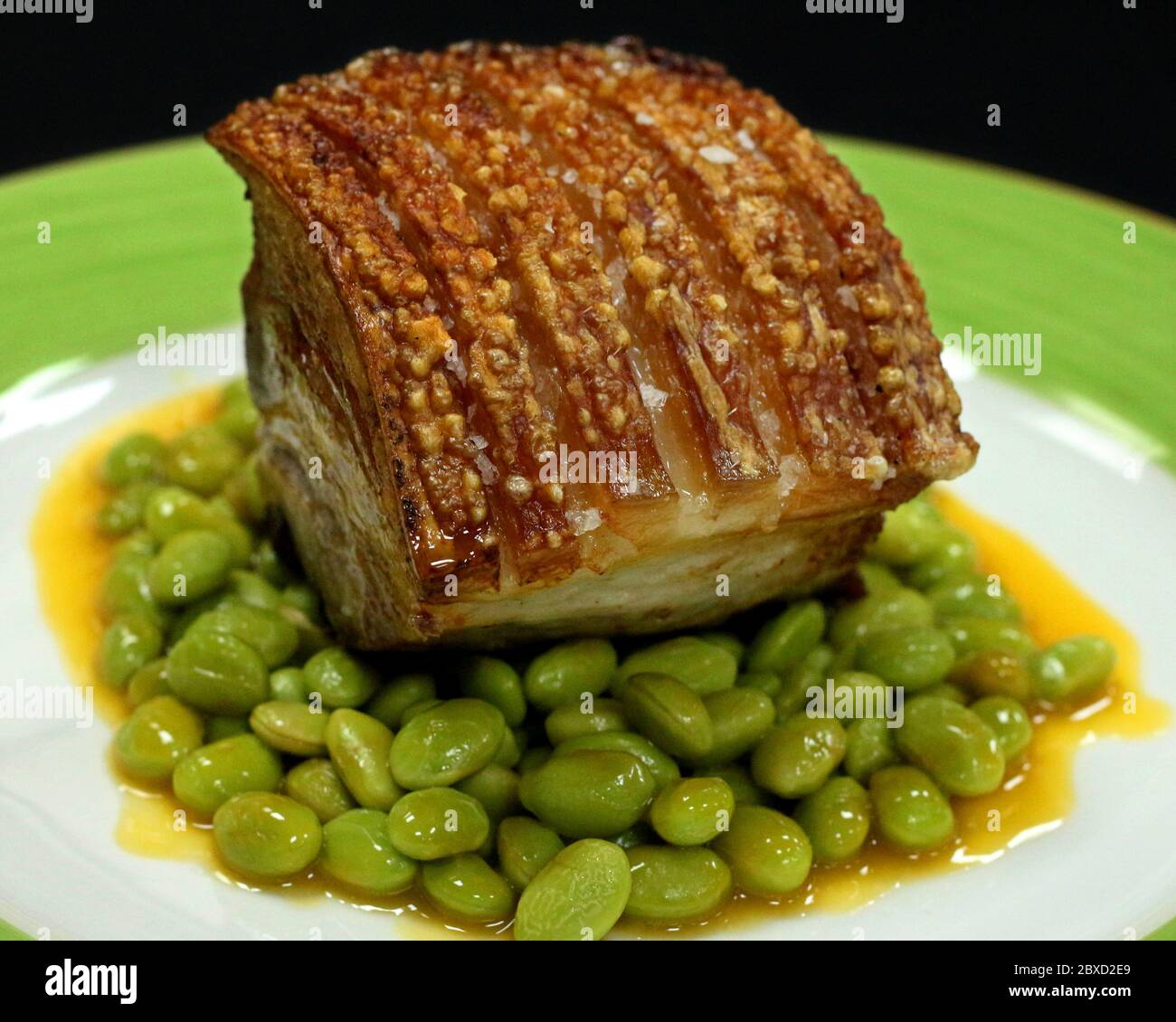 pork belly with green soybeans and orange sauce Stock Photo Alamy