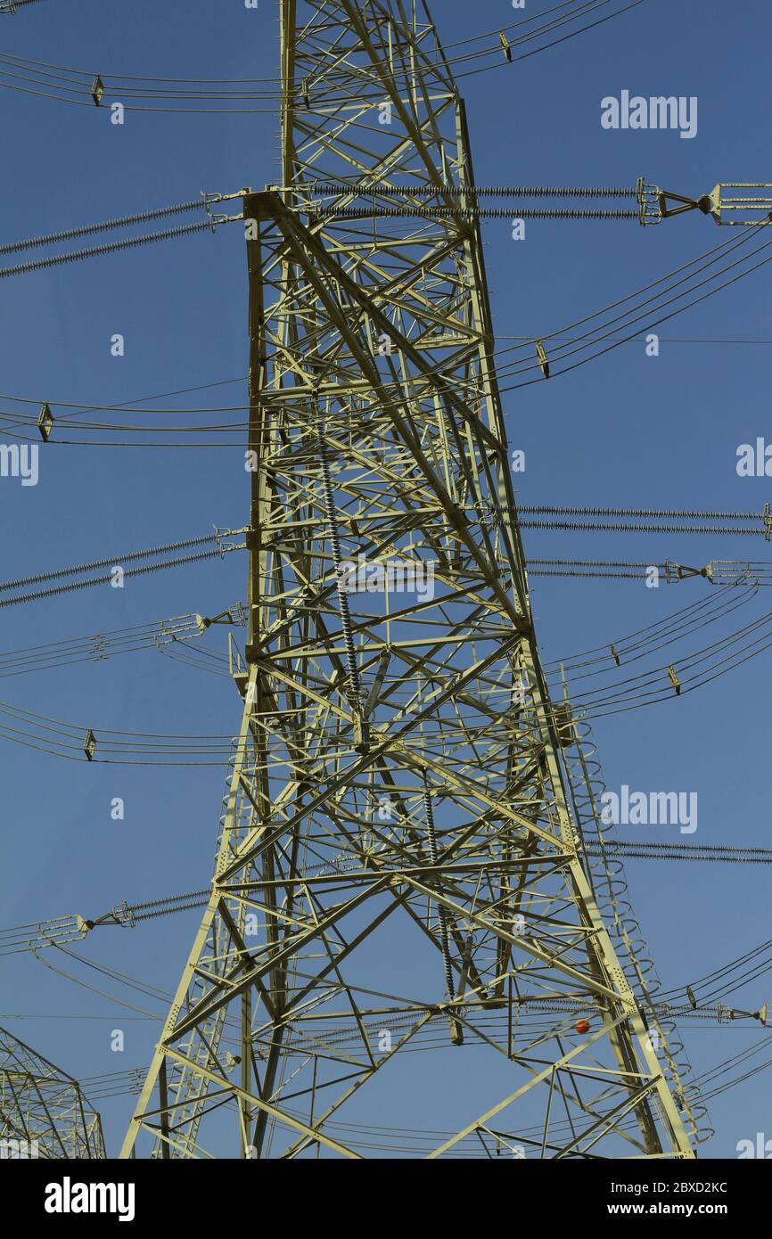high voltage electric tower line with blue sky background Stock Photo ...