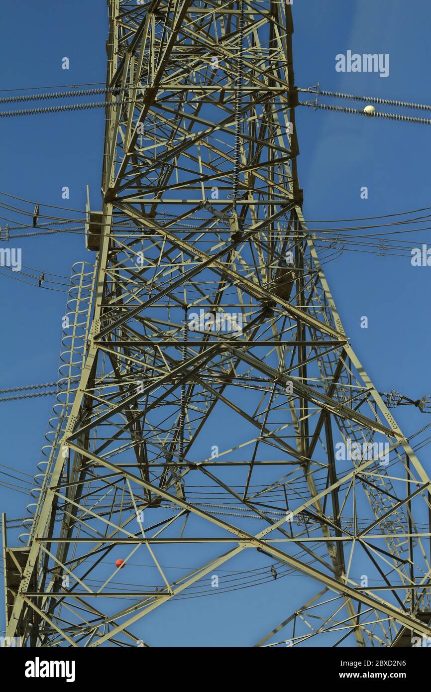 high voltage electric tower line with blue sky background Stock Photo ...
