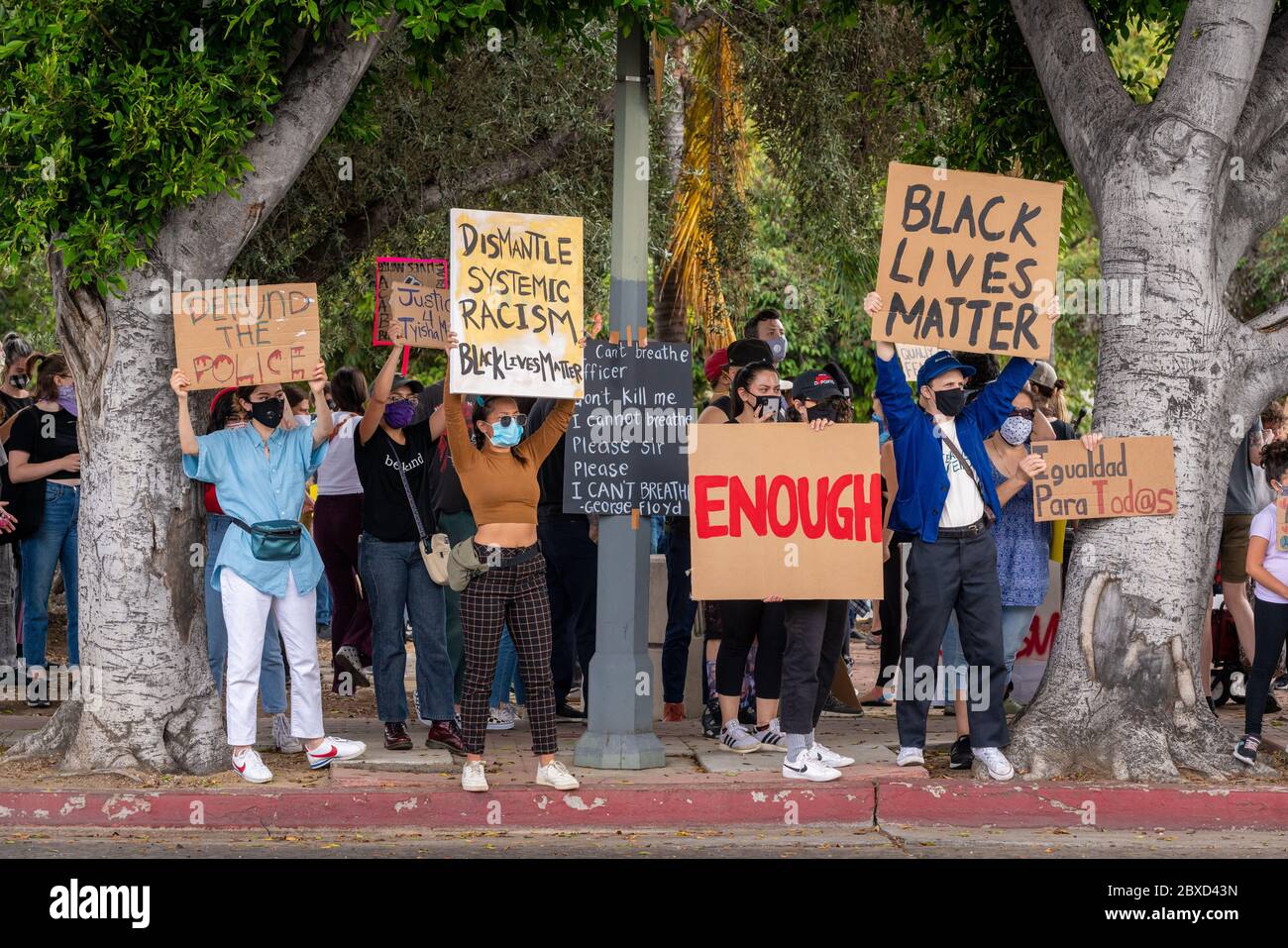 Los Angeles, USA. 5th June, 2020. Demonstrators with protest signs, honoring the death of George Floyd at Figueroa St and York Blvd, in Highland Park. Credit: Jim Newberry/Alamy Live News Stock Photo