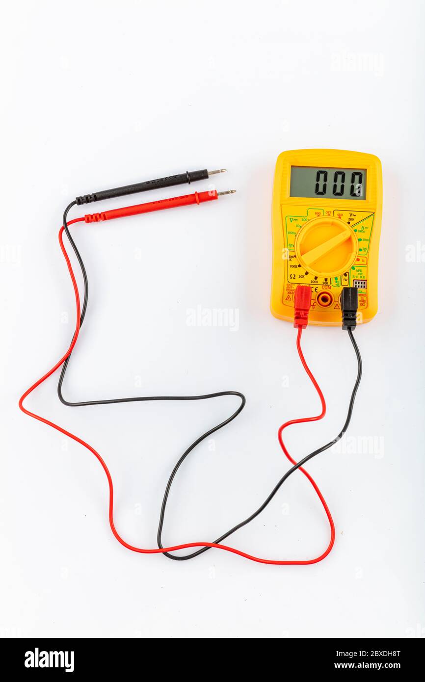 Digital yellow multimeter meter isolated to check the resistance on a