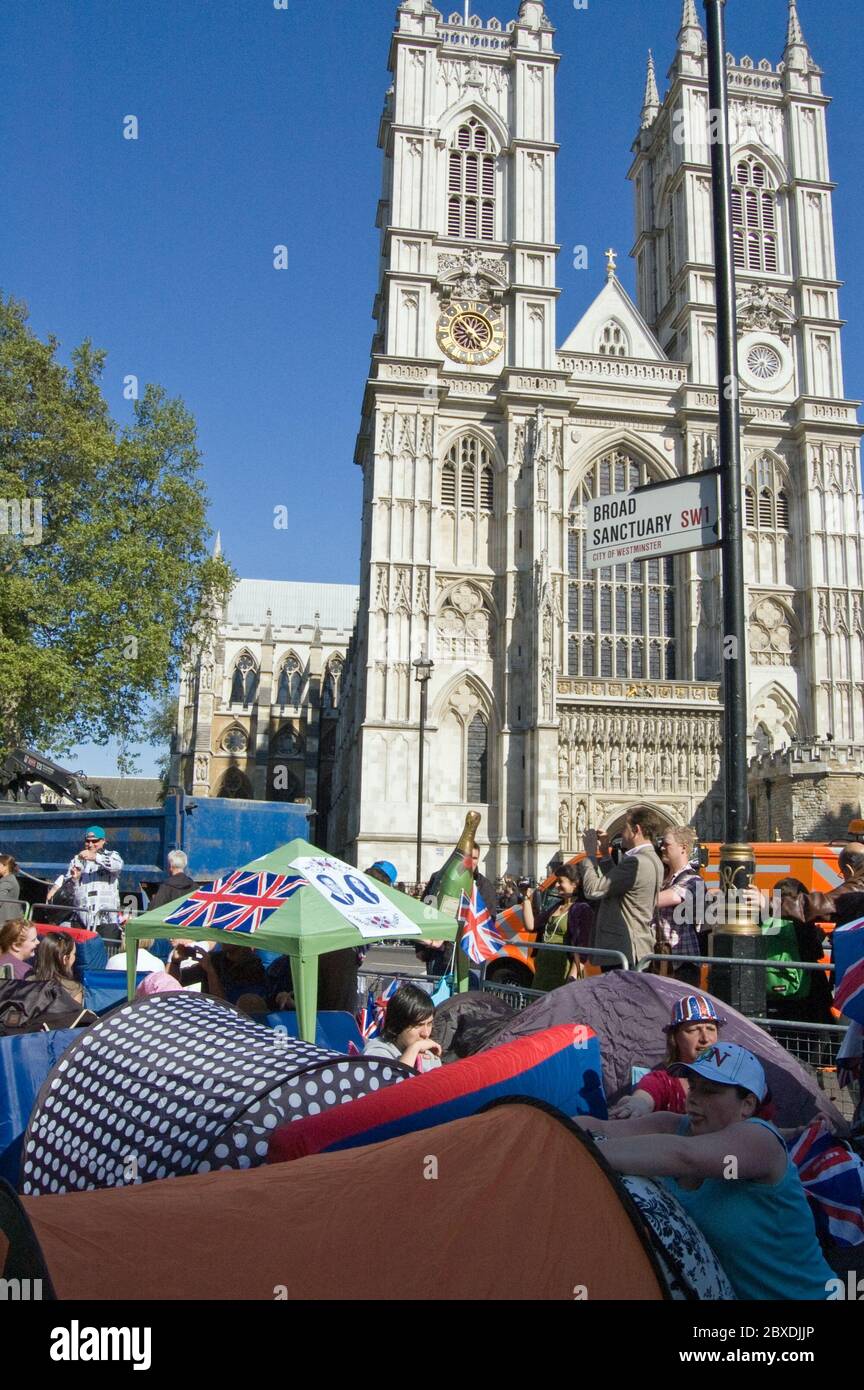 London, UK - April 27, 2011:  Royal Wedding enthusiasts camp on the street by Westminster Abbey hoping to get a good view of the Royal Wedding of Prin Stock Photo