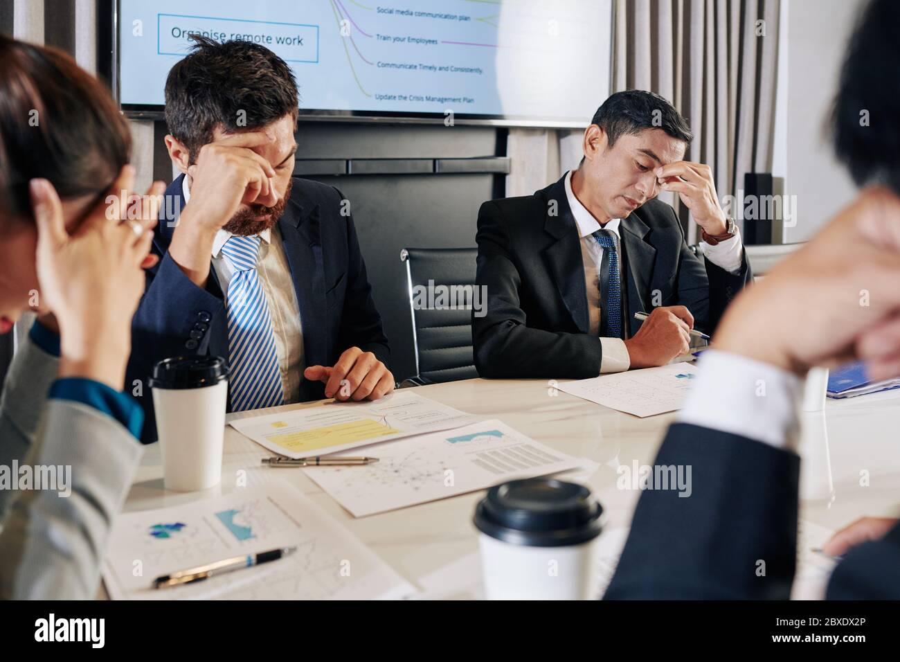 Managers of company financial department meeting to discuss problems ...