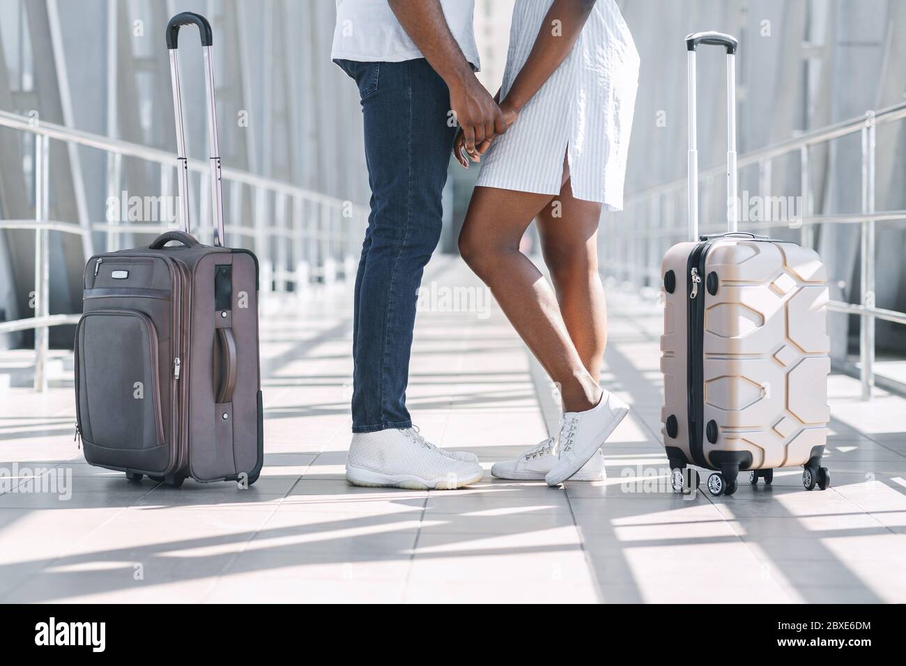 Happy Reunion. Loving black couple holding hands at airport terminal ...