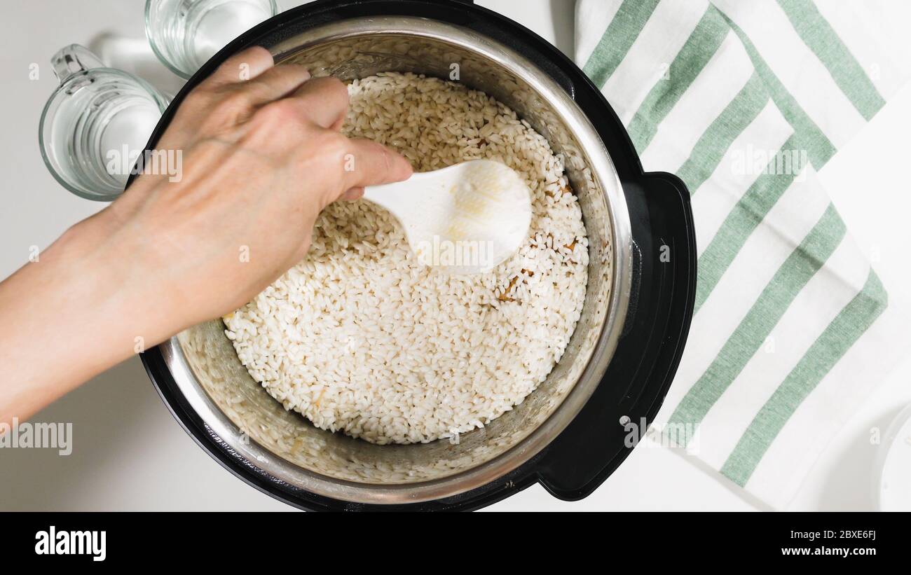 Rice in a pot. Cooking rice with meat and vegetables in pressure multi