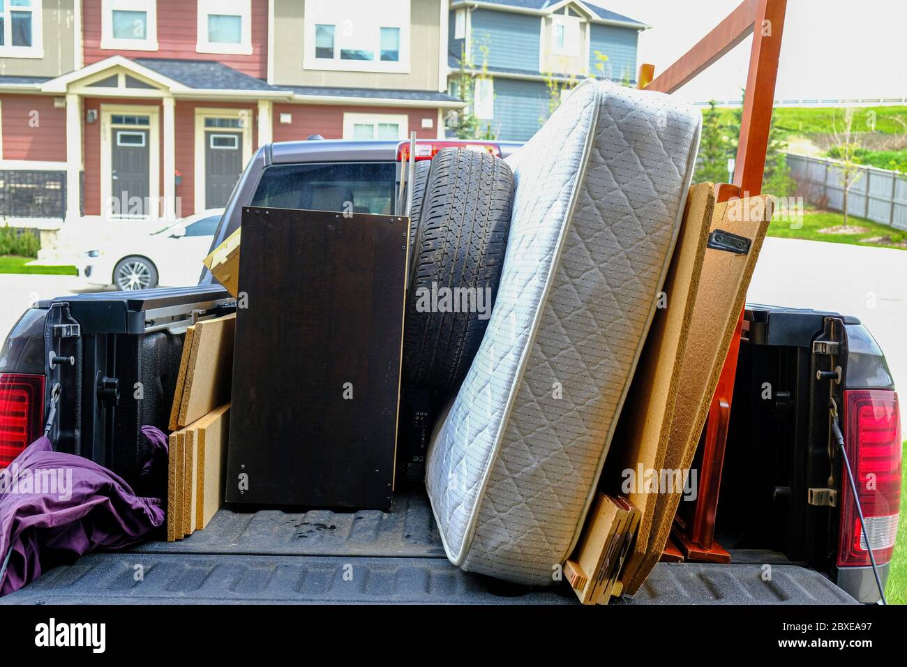 Trash items loaded on a truck to be disposed of at a landfill Stock