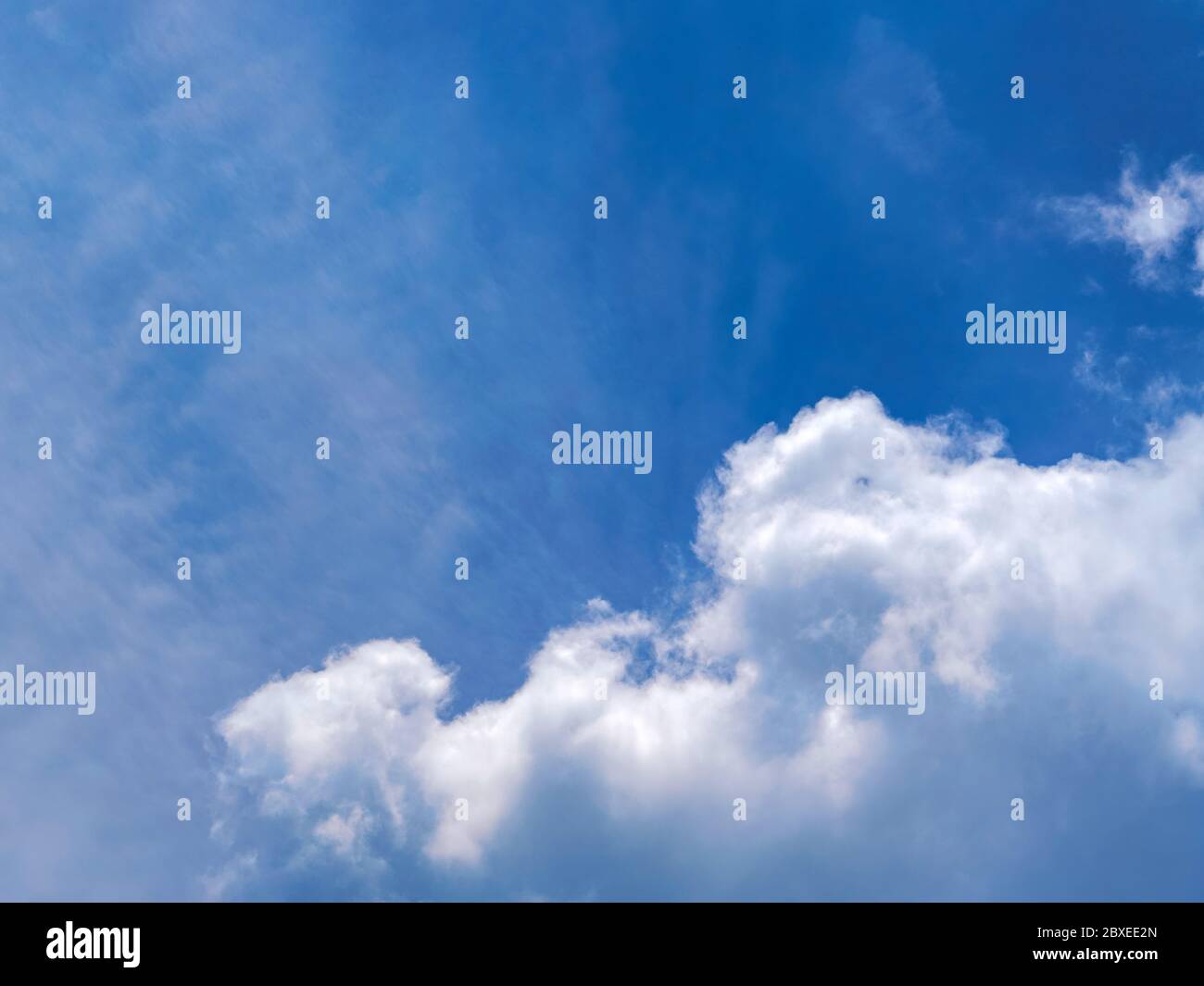 Big white cloud in clear blue sky Stock Photo - Alamy